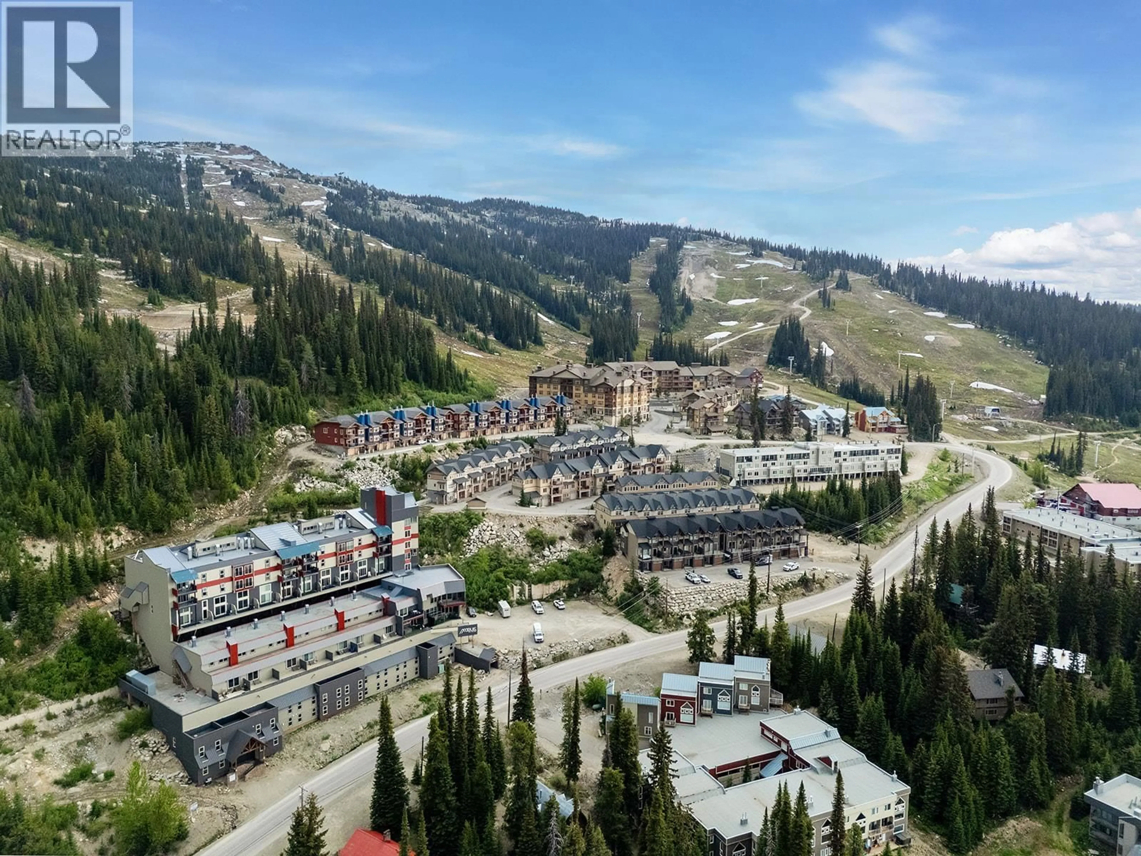 A pic from outside/outdoor area/front of a property/back of a property/a pic from drone, mountain view for 803 - 7470 PORCUPINE ROAD, Big White British Columbia V1P1P3