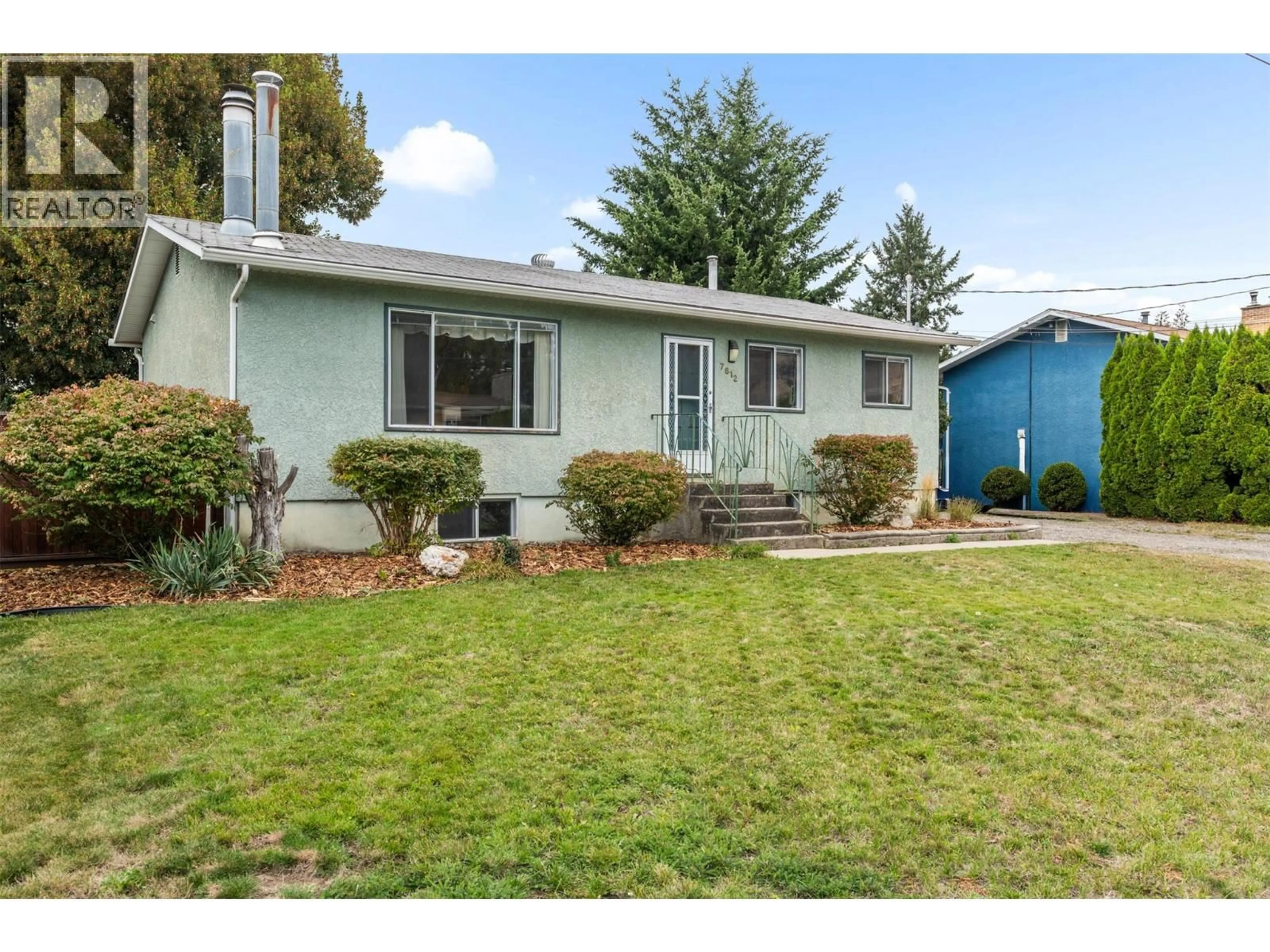 Home with vinyl exterior material, street for 7612 BIRCH LANE, Coldstream British Columbia V1B1N9