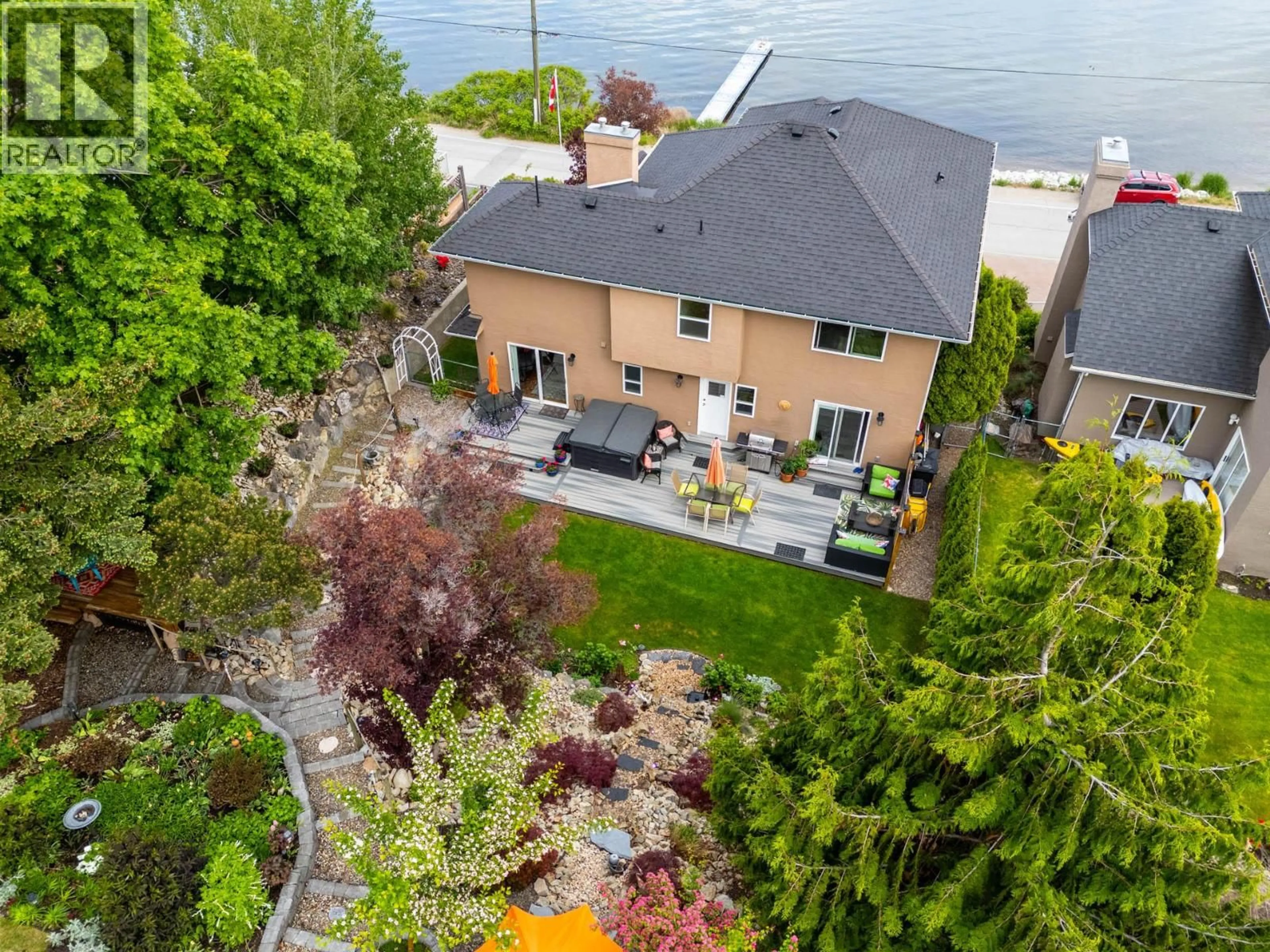 A pic from outside/outdoor area/front of a property/back of a property/a pic from drone, water/lake/river/ocean view for 3838 BEACH AVENUE, Peachland British Columbia V0H1X1