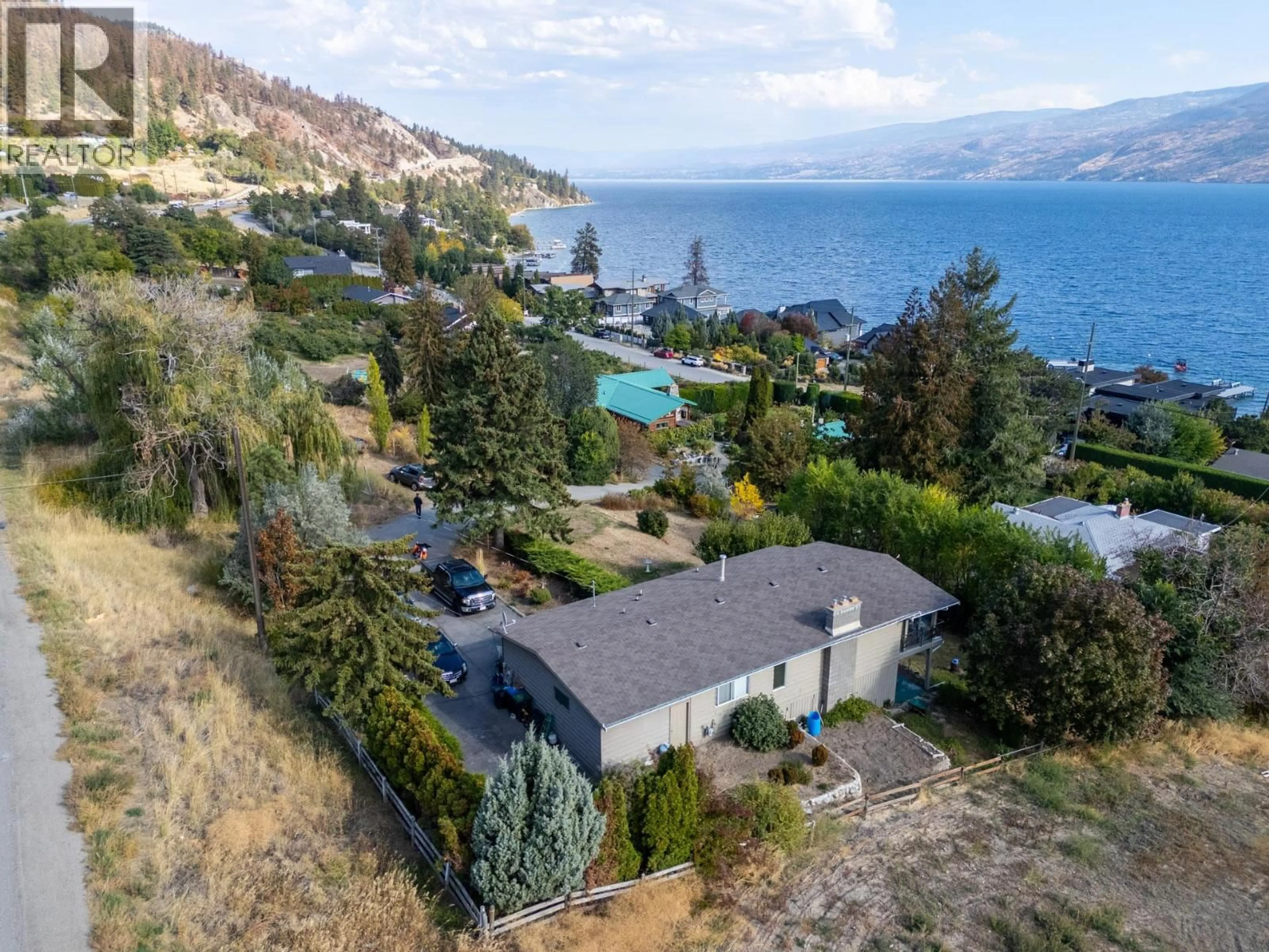 A pic from outside/outdoor area/front of a property/back of a property/a pic from drone, water/lake/river/ocean view for 5284 TAILYOUR LANE, Peachland British Columbia V0H1X1