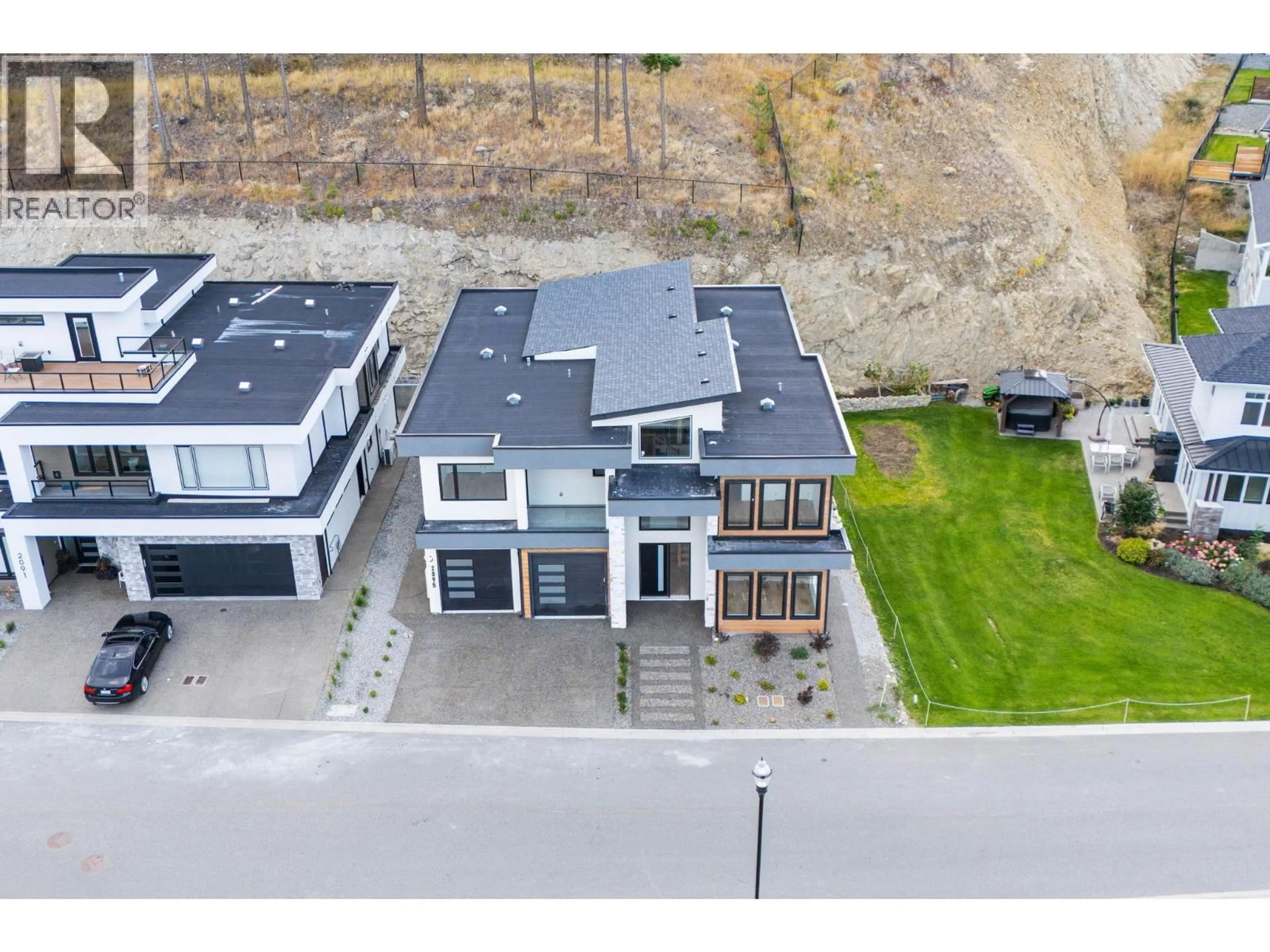 A pic from outside/outdoor area/front of a property/back of a property/a pic from drone, street for 2095 CORTINA DRIVE, Kelowna British Columbia V1P1V1