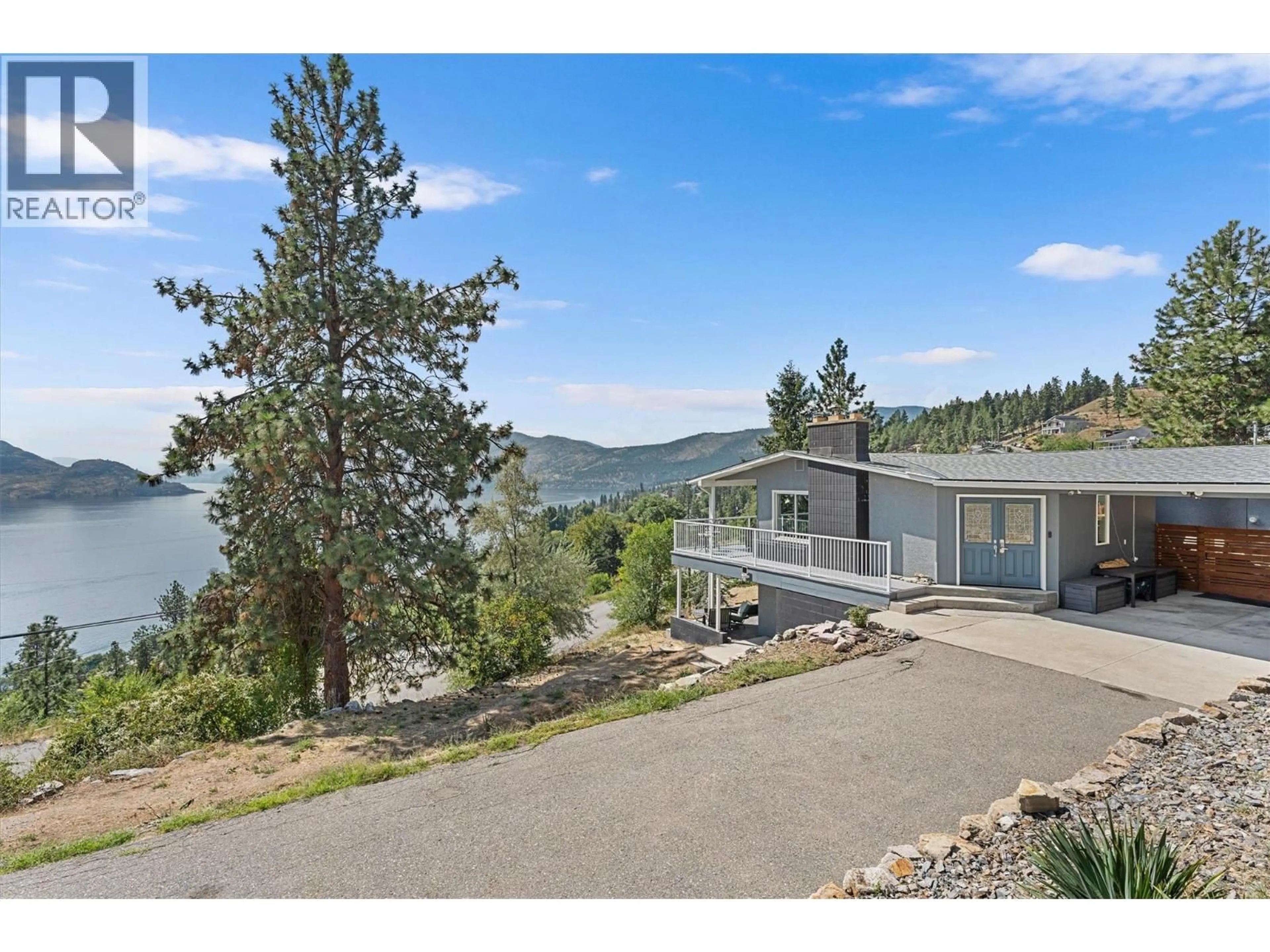 A pic from outside/outdoor area/front of a property/back of a property/a pic from drone, water/lake/river/ocean view for 5815 MACGREGOR ROAD, Peachland British Columbia V0H1X4