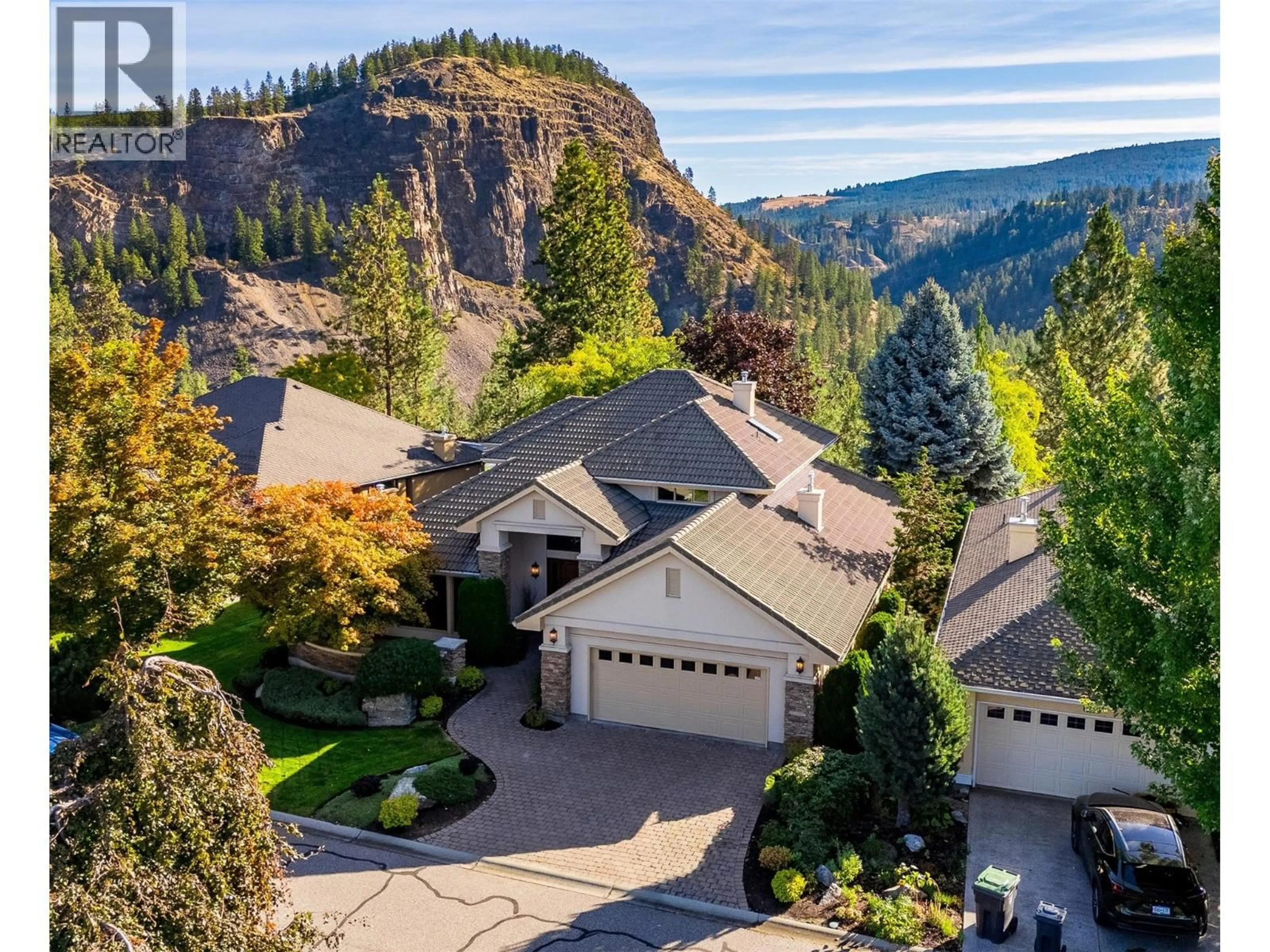 A pic from outside/outdoor area/front of a property/back of a property/a pic from drone, mountain view for 3875 GALLAGHERS PARKWAY, Kelowna British Columbia V1W3Z8