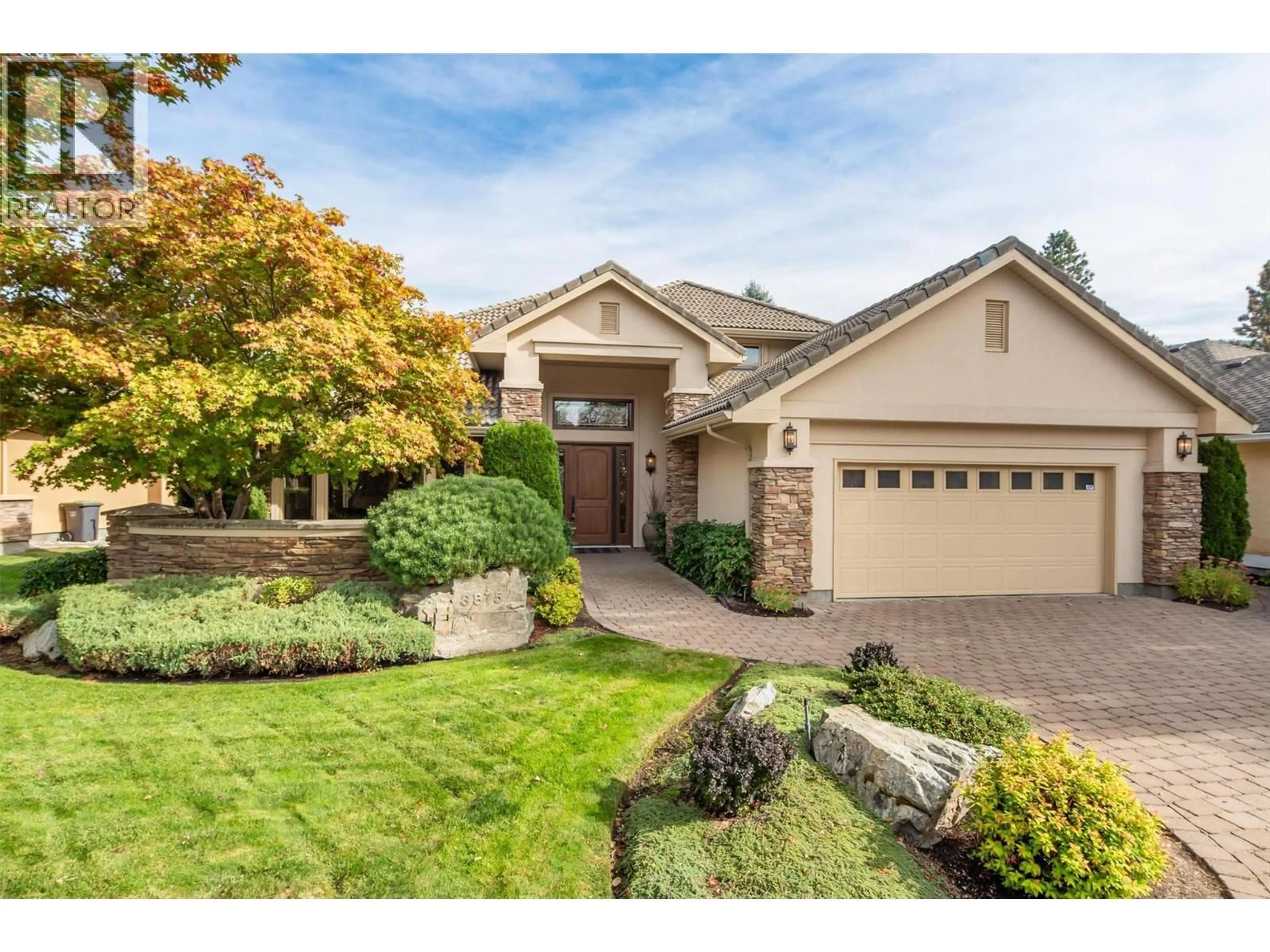 Home with brick exterior material, street for 3875 GALLAGHERS PARKWAY, Kelowna British Columbia V1W3Z8