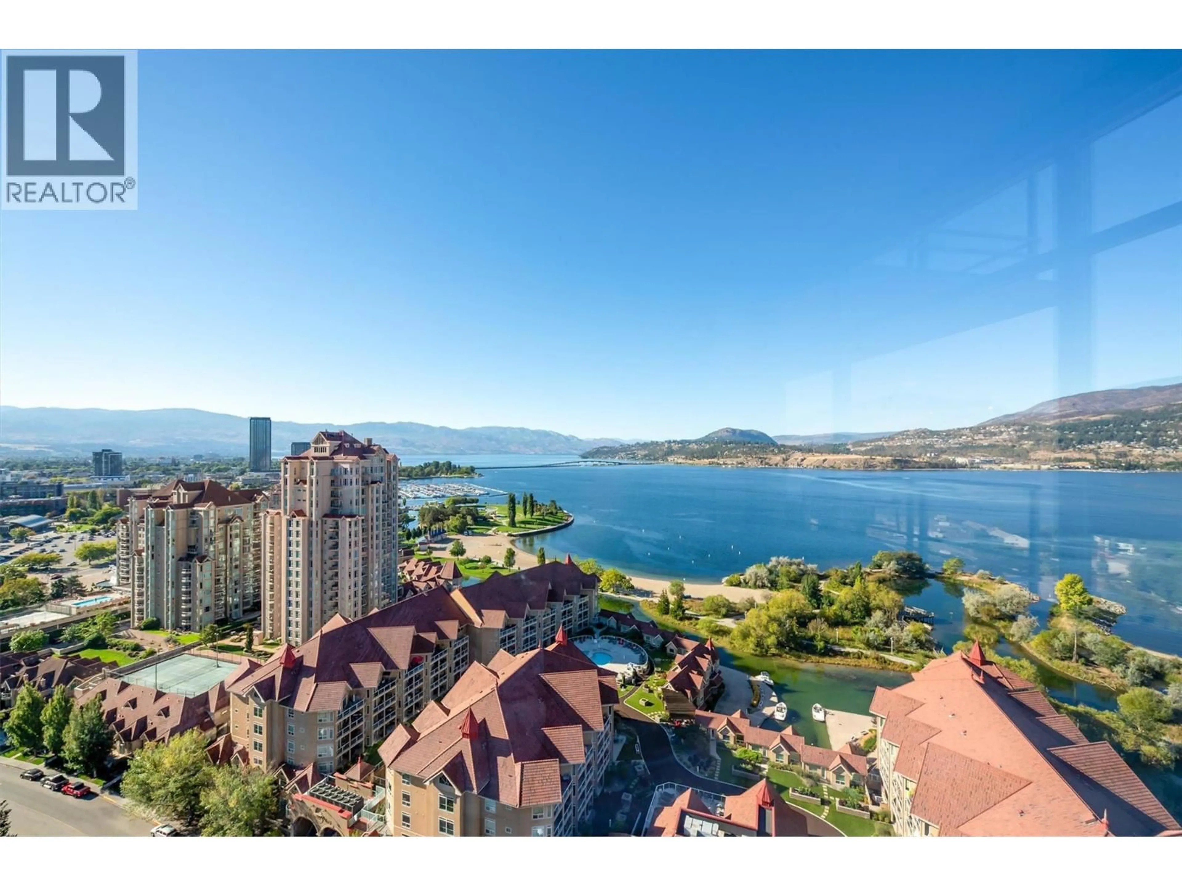 A pic from outside/outdoor area/front of a property/back of a property/a pic from drone, water/lake/river/ocean view for 2408 - 1075 SUNSET DRIVE, Kelowna British Columbia V1Y9Y9