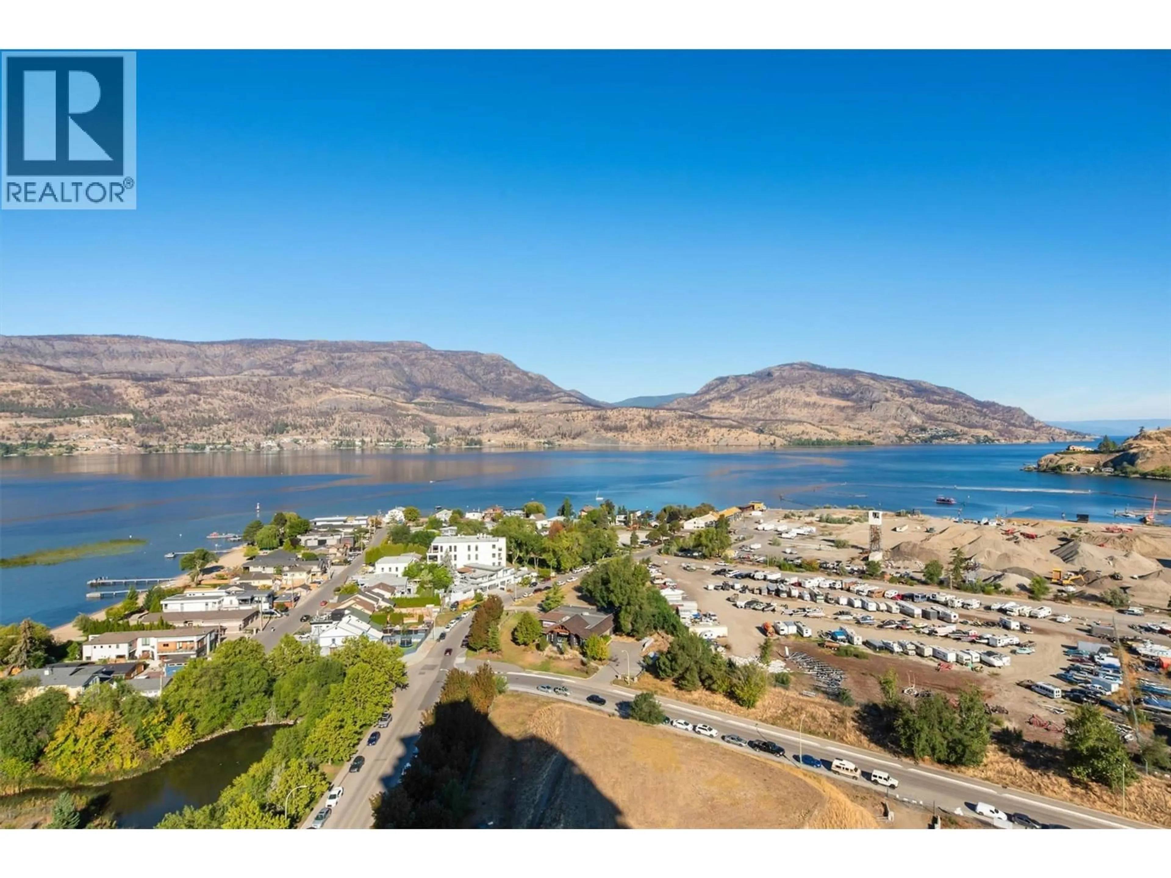 A pic from outside/outdoor area/front of a property/back of a property/a pic from drone, water/lake/river/ocean view for 2408 - 1075 SUNSET DRIVE, Kelowna British Columbia V1Y9Y9