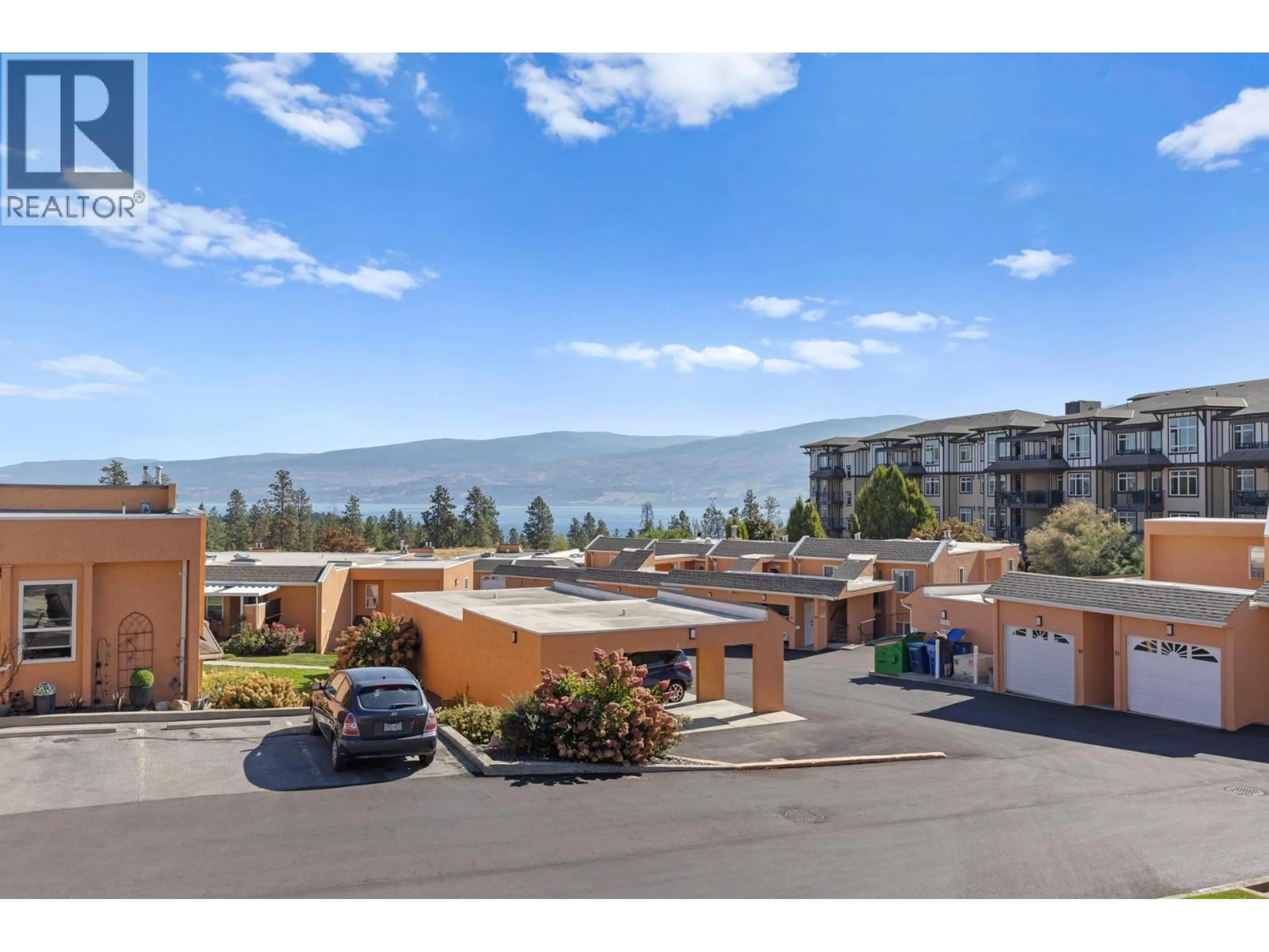 A pic from outside/outdoor area/front of a property/back of a property/a pic from drone, mountain view for 4 - 2433 INGRAM ROAD, West Kelowna British Columbia V4T1L5
