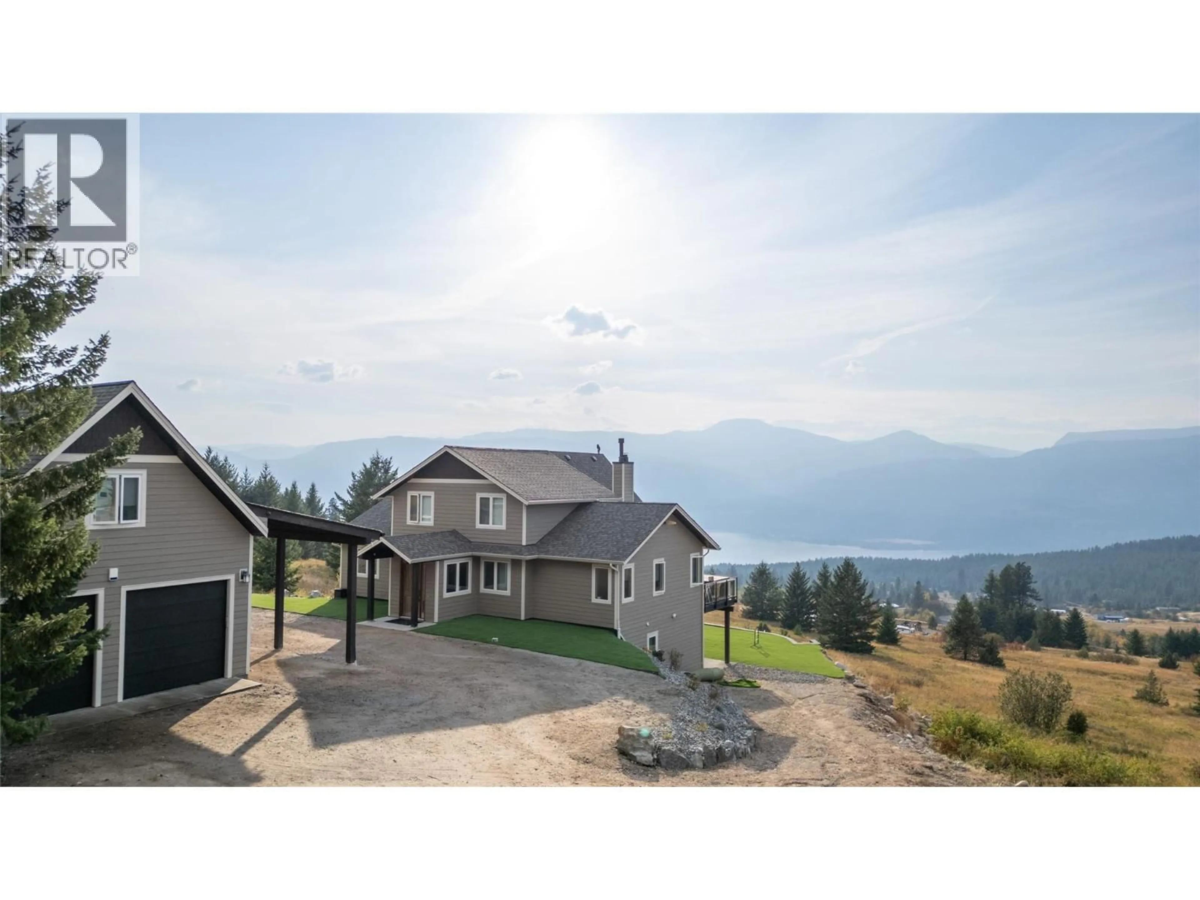 A pic from outside/outdoor area/front of a property/back of a property/a pic from drone, mountain view for 18252 ANGUS ROAD, Lake Country British Columbia V4V1B6