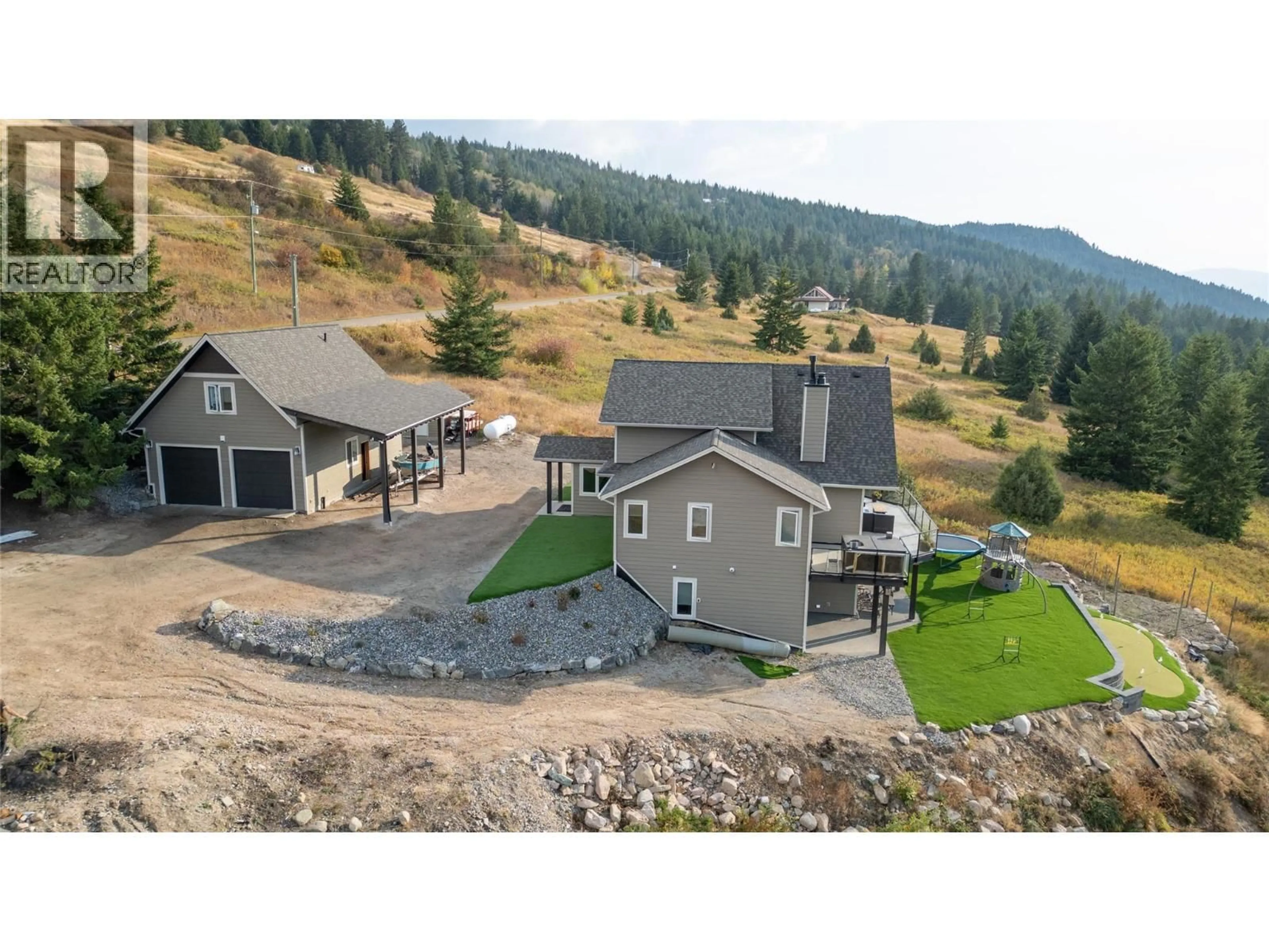 A pic from outside/outdoor area/front of a property/back of a property/a pic from drone, mountain view for 18252 ANGUS ROAD, Lake Country British Columbia V4V1B6