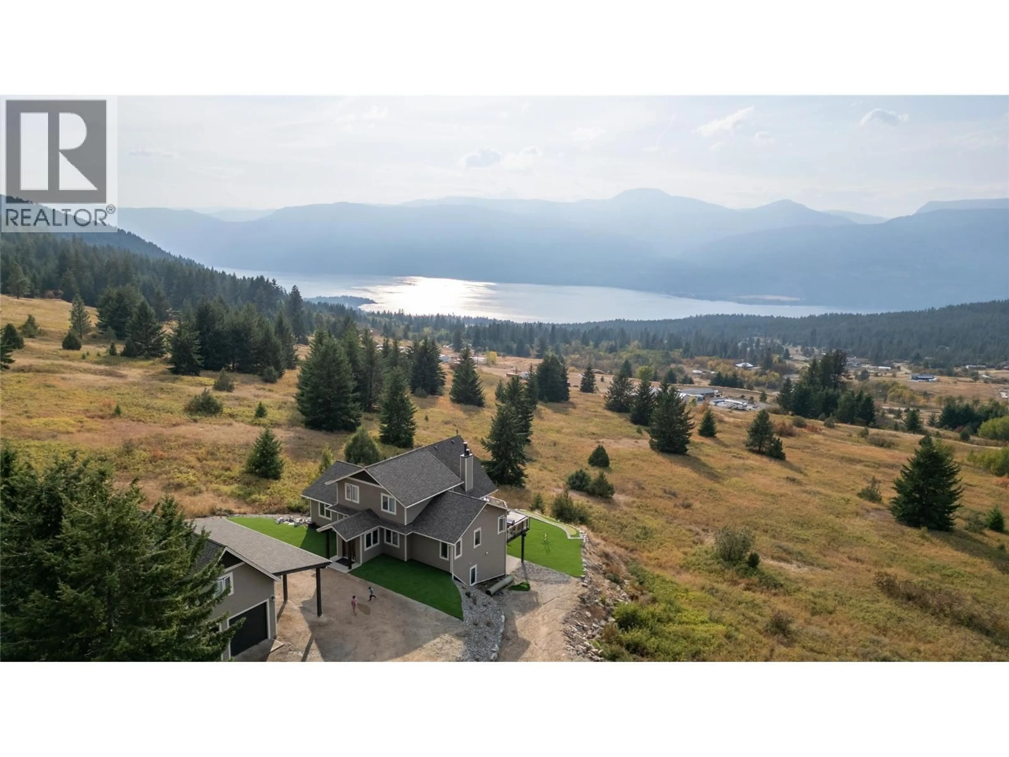A pic from outside/outdoor area/front of a property/back of a property/a pic from drone, water/lake/river/ocean view for 18252 ANGUS ROAD, Lake Country British Columbia V4V1B6