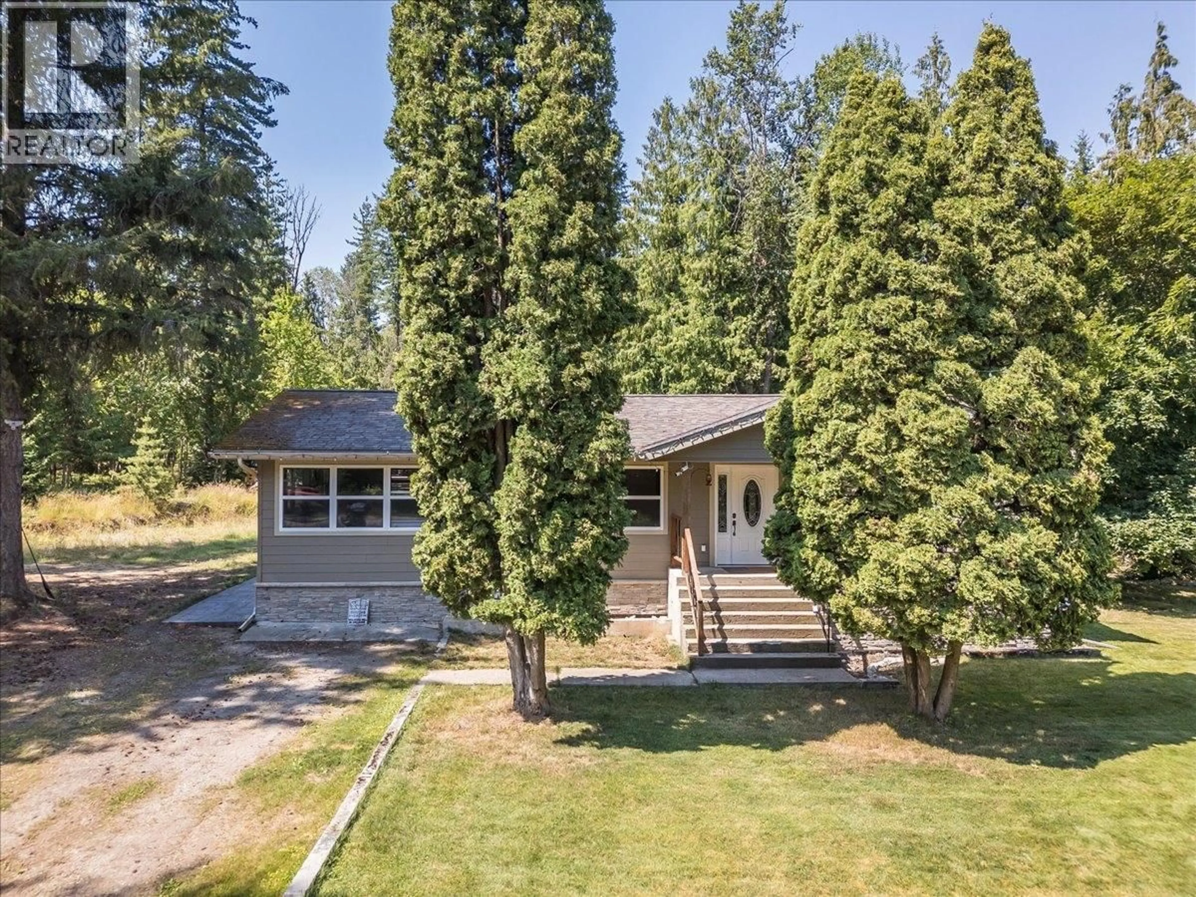 A pic from outside/outdoor area/front of a property/back of a property/a pic from drone, forest/trees view for 6010 HARROP-PROCTER ROAD, Nelson British Columbia V1L6P7