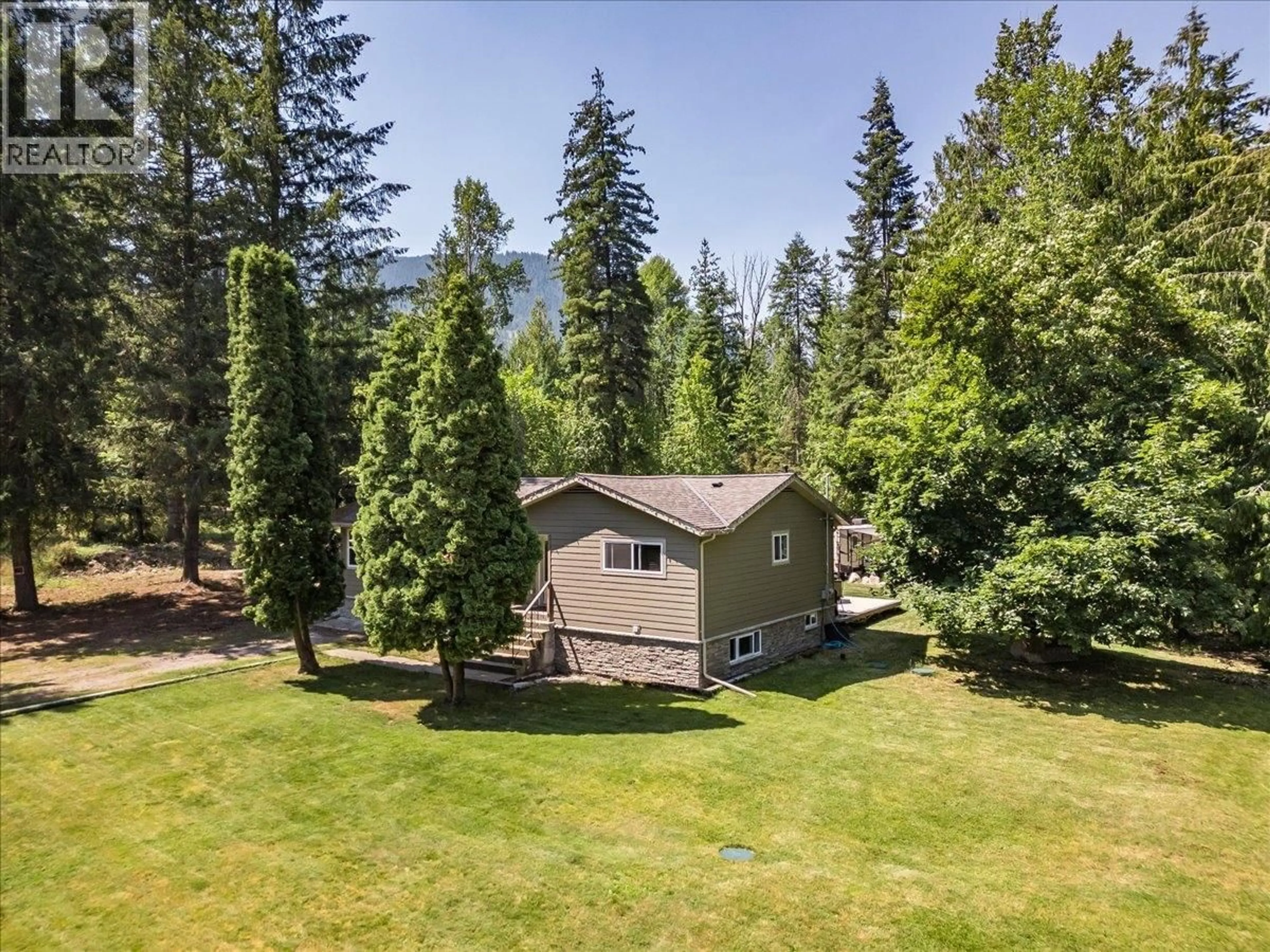 A pic from outside/outdoor area/front of a property/back of a property/a pic from drone, forest/trees view for 6010 HARROP-PROCTER ROAD, Nelson British Columbia V1L6P7
