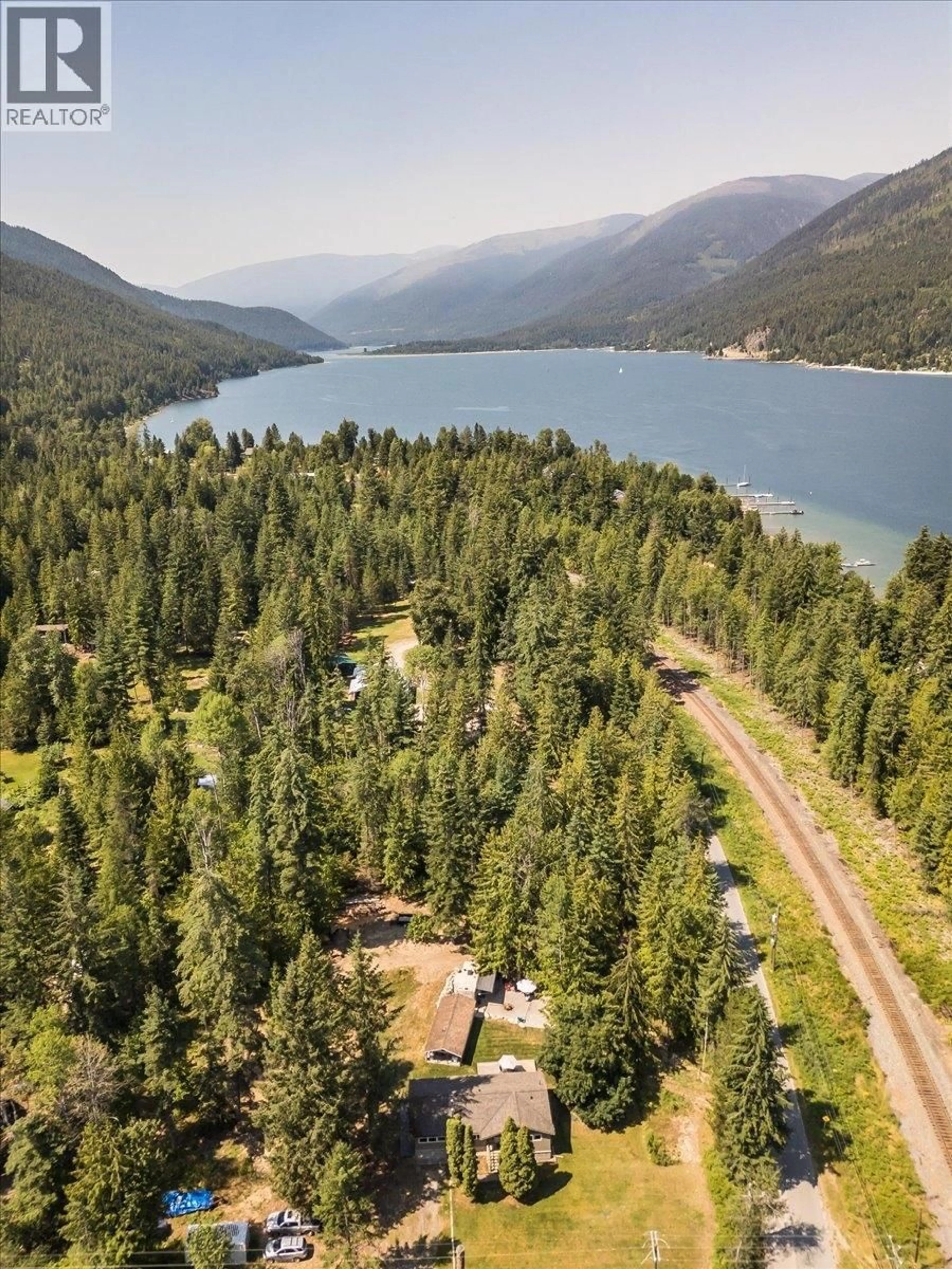 A pic from outside/outdoor area/front of a property/back of a property/a pic from drone, water/lake/river/ocean view for 6010 HARROP-PROCTER ROAD, Nelson British Columbia V1L6P7