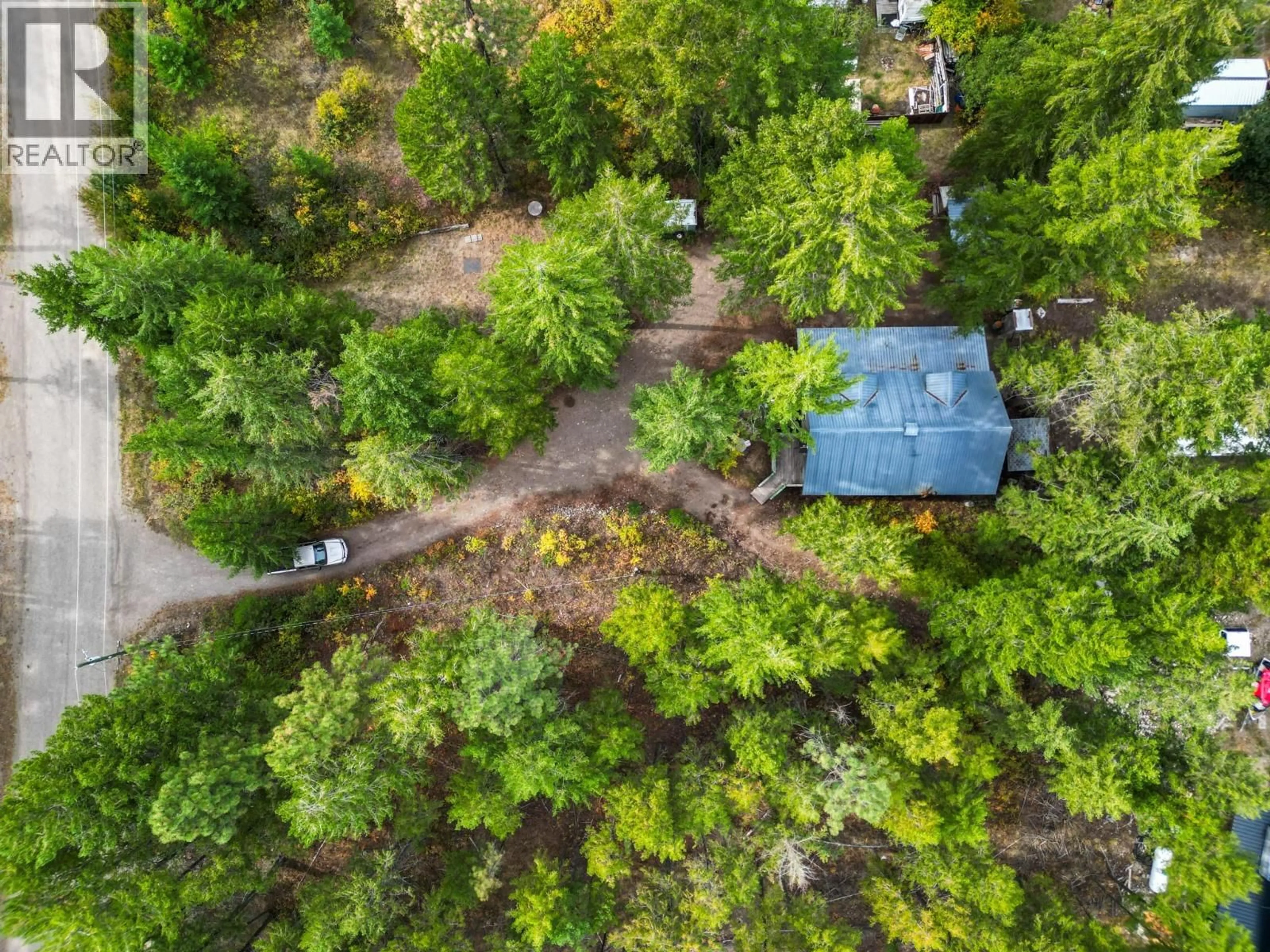 A pic from outside/outdoor area/front of a property/back of a property/a pic from drone, forest/trees view for 860 BALSAM ROAD, Kelowna British Columbia V1Z3V7