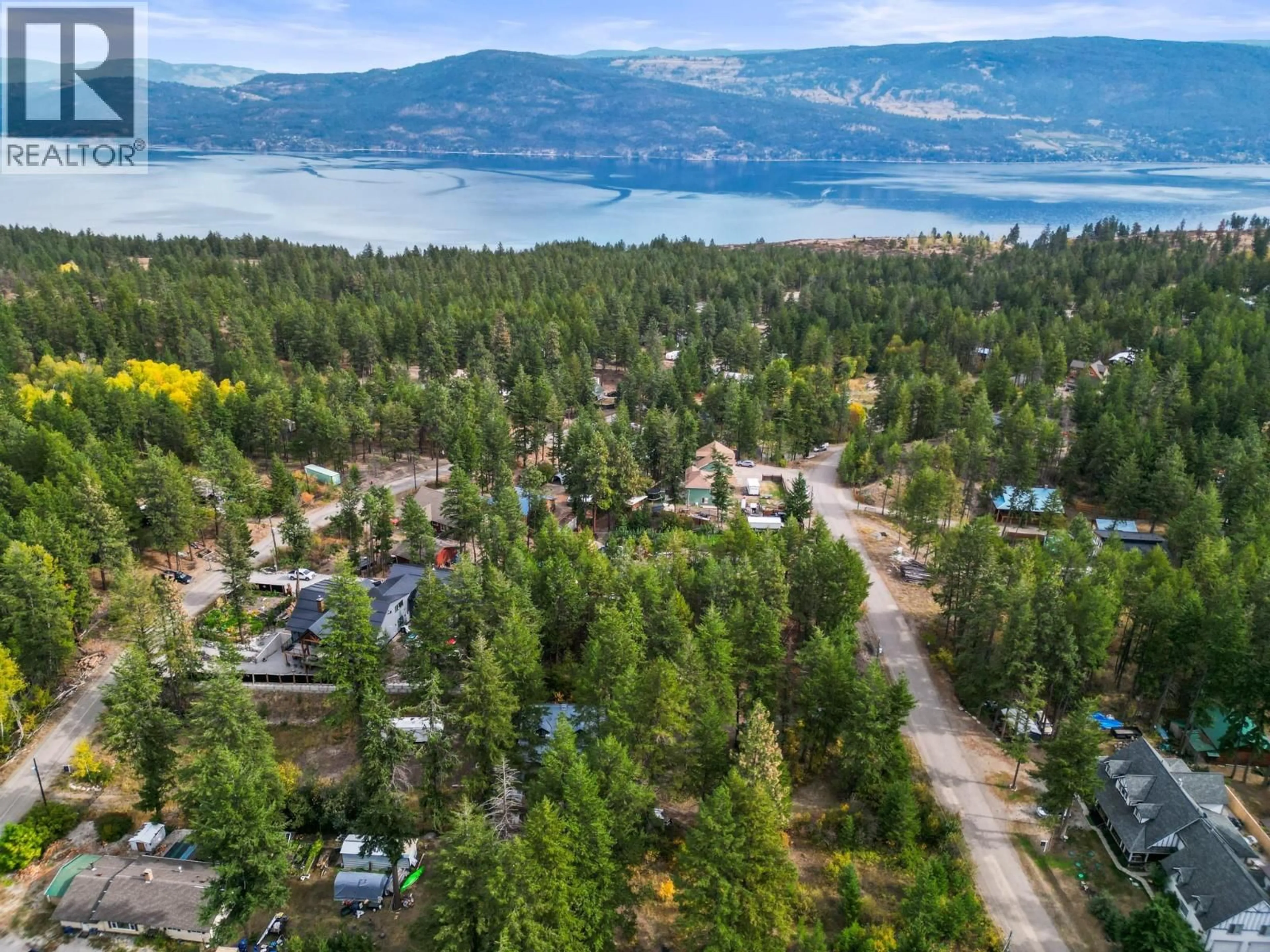 A pic from outside/outdoor area/front of a property/back of a property/a pic from drone, forest/trees view for 860 BALSAM ROAD, Kelowna British Columbia V1Z3V7