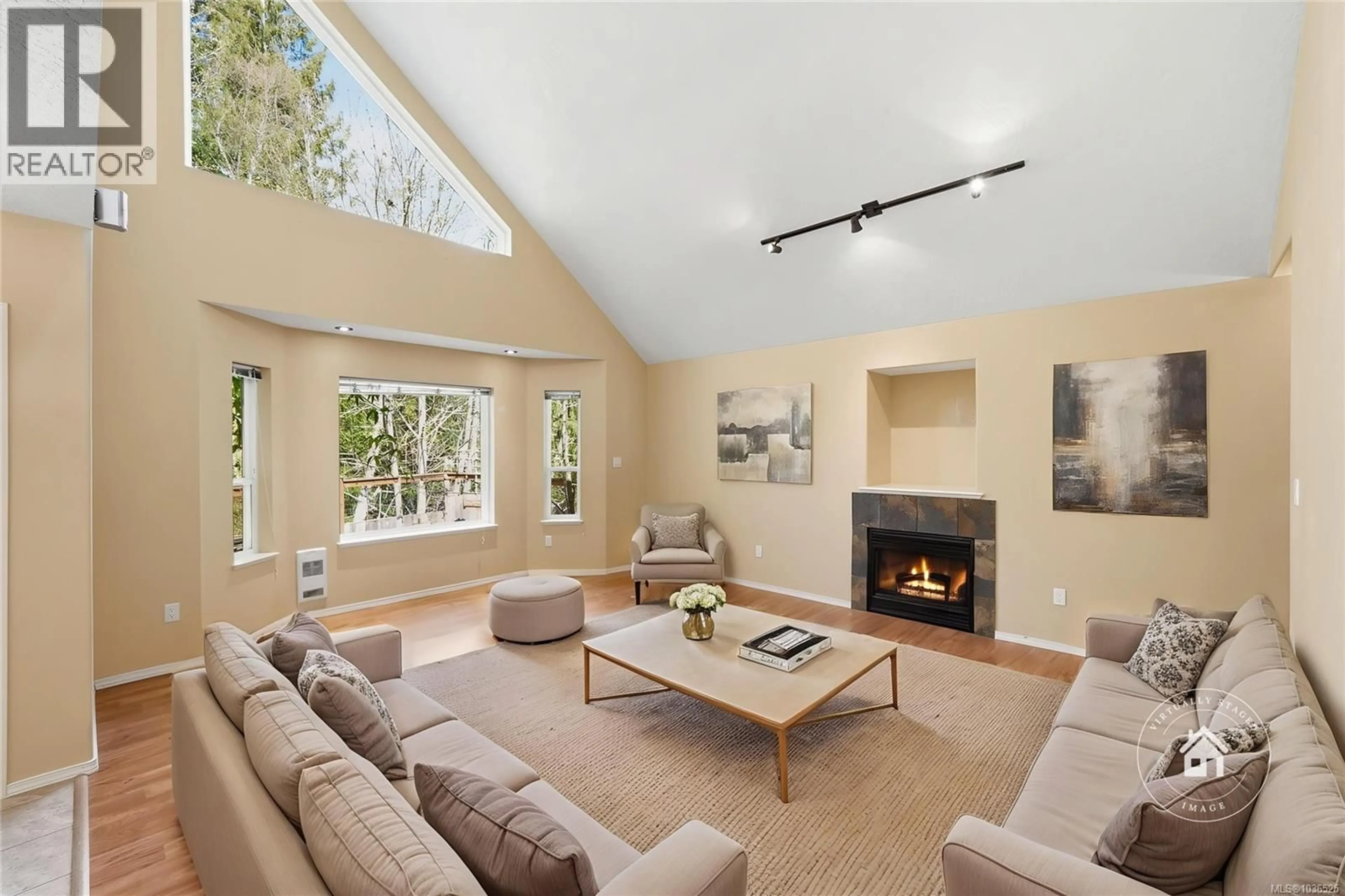 Living room with furniture, unknown for 1727 MIAMA COURT, Qualicum Beach British Columbia V9K2S3