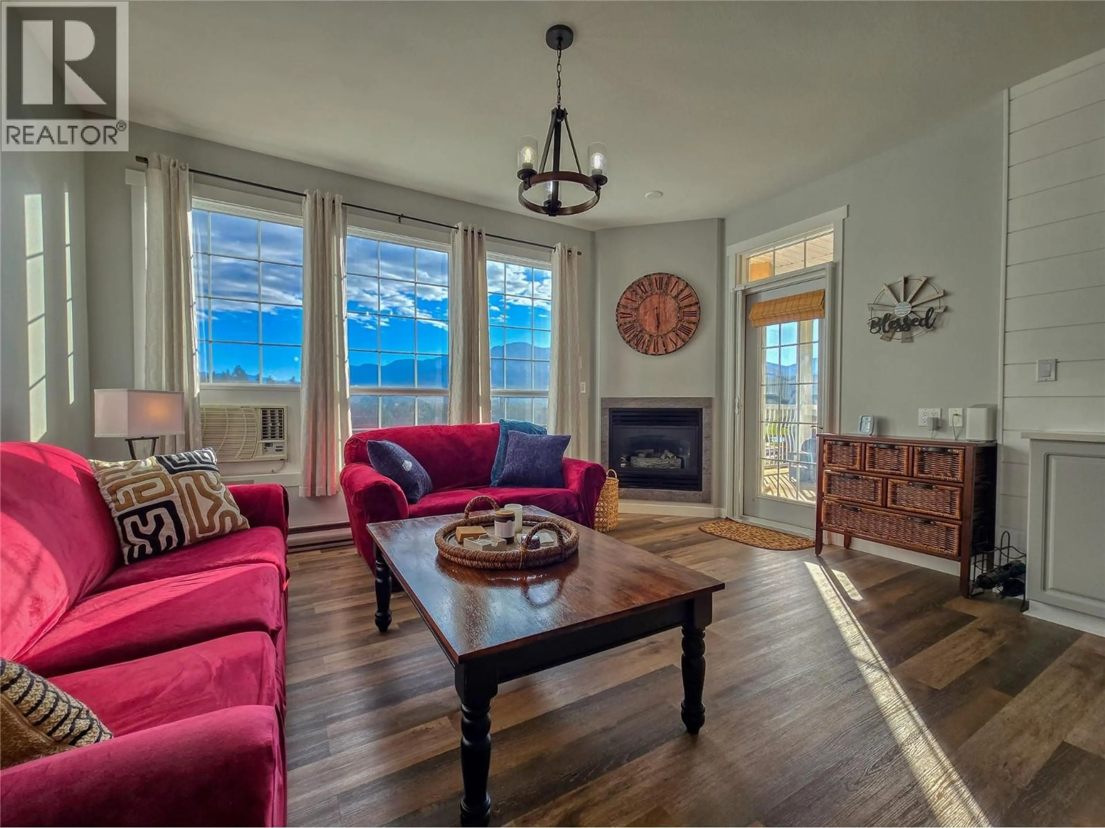 Living room with furniture, wood/laminate floor for 2008A - 5052 RIVERVIEW ROAD, Fairmont Hot Springs British Columbia V0B1L1