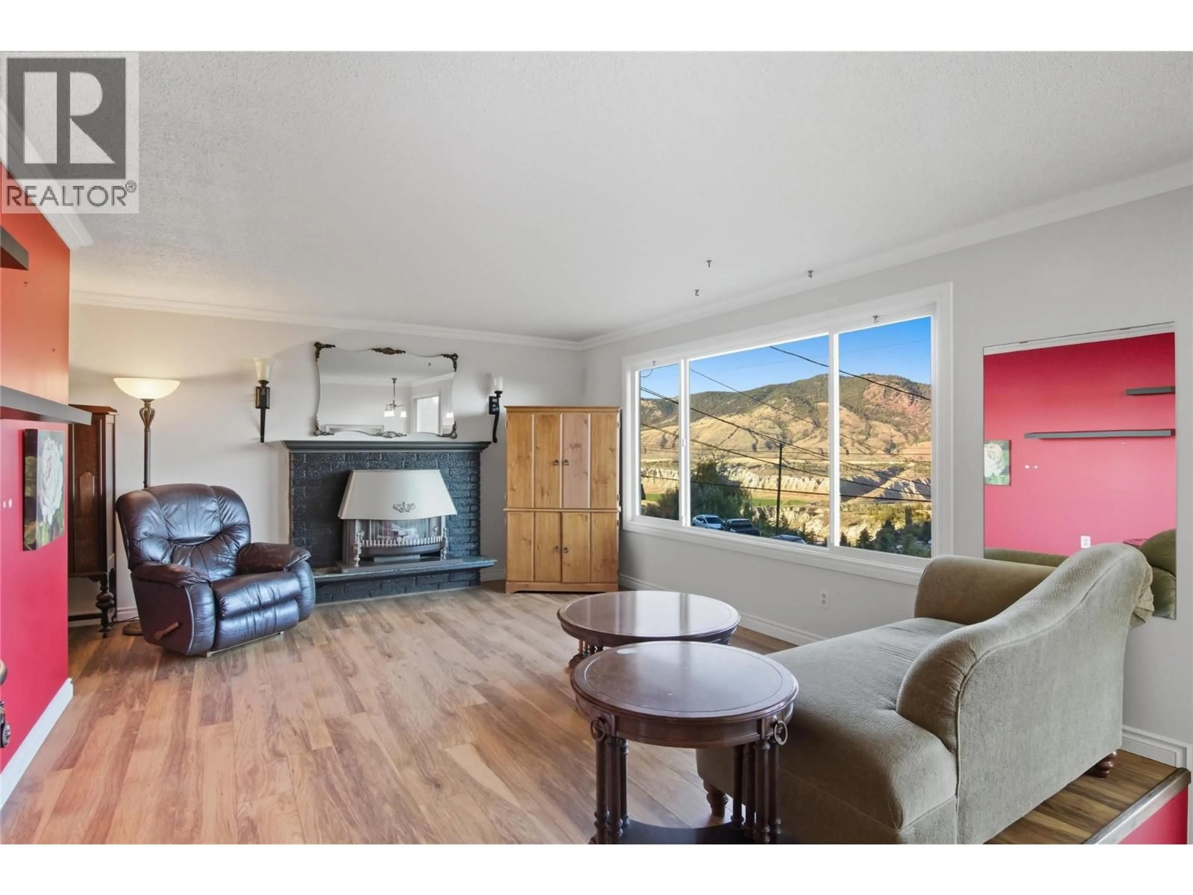 Living room with furniture, wood/laminate floor for 1047 LAMAR PLACE, Kamloops British Columbia V2C5V2
