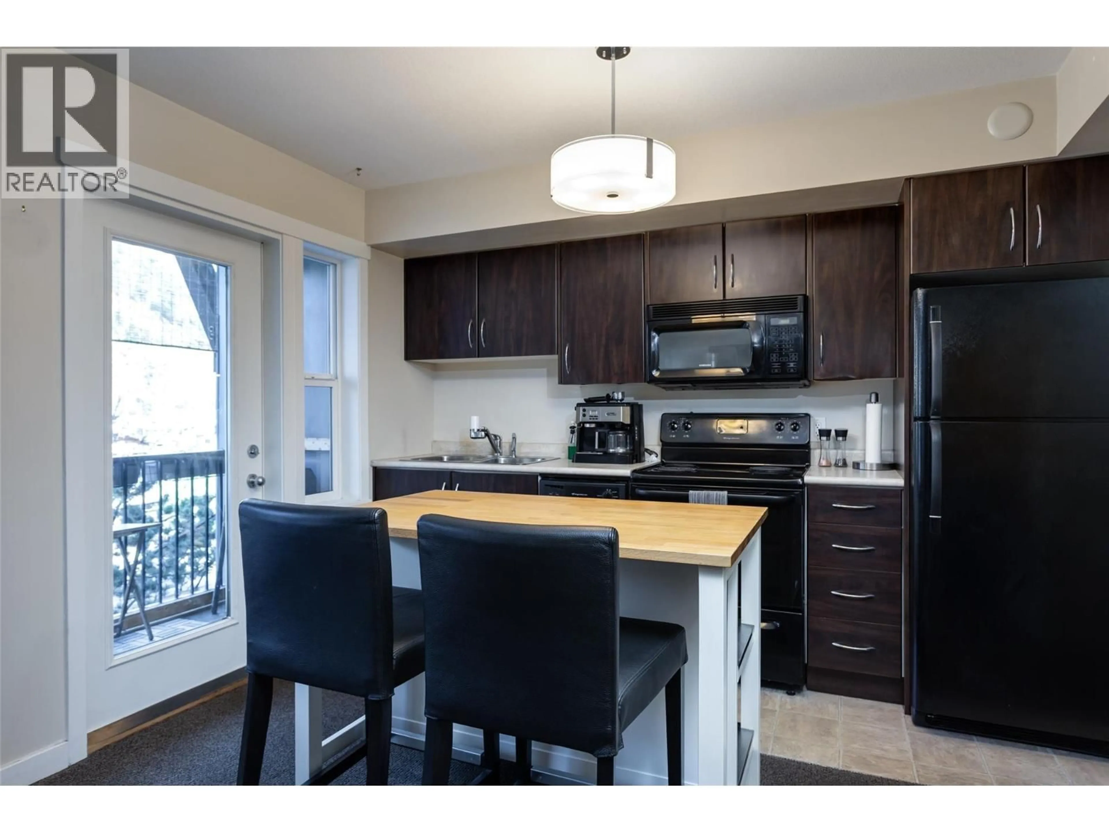 Open concept kitchen, wood/laminate floor for 205A - 1475 GLENMORE ROAD NORTH, Kelowna British Columbia V1V2C5
