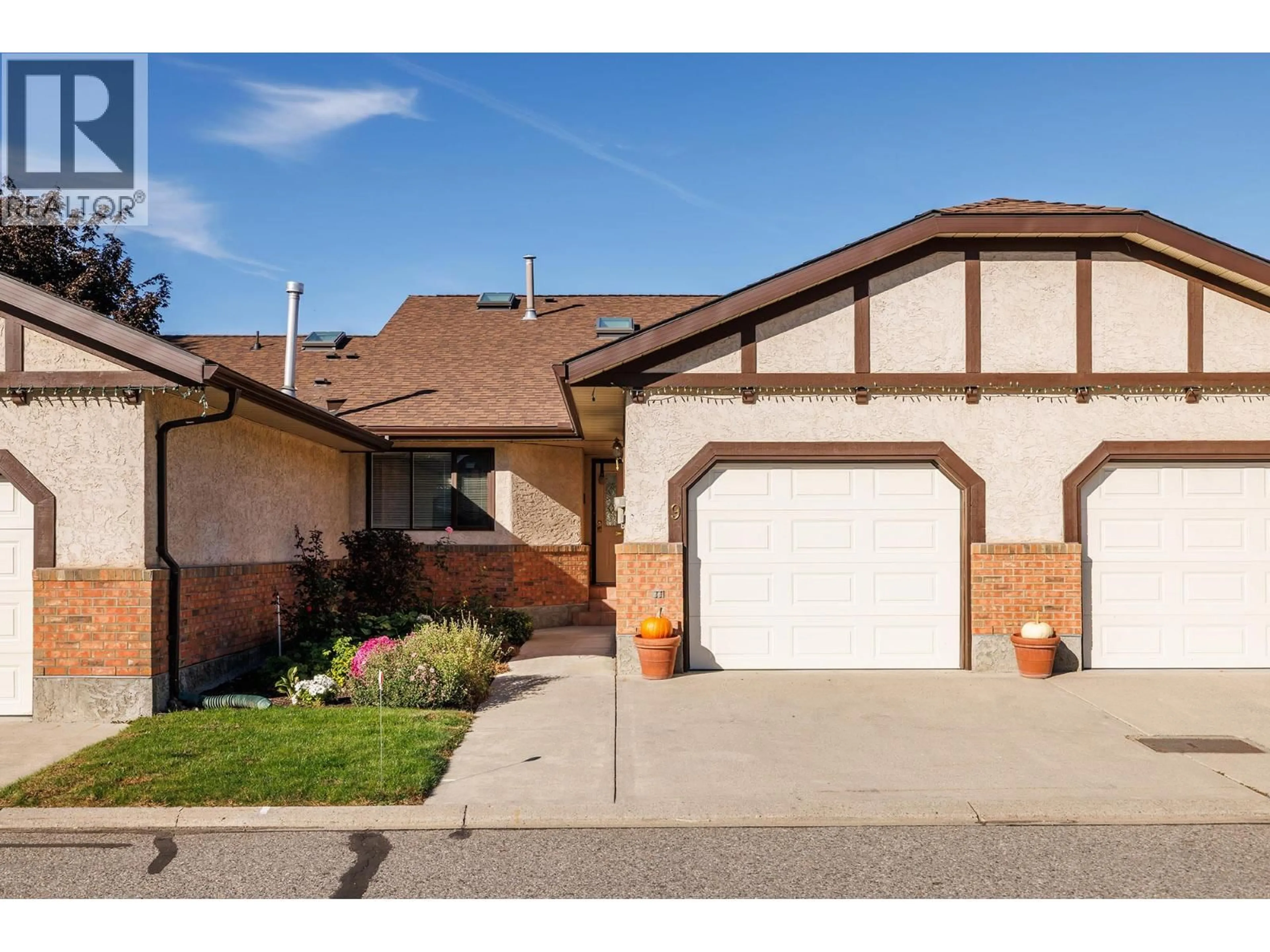 Home with brick exterior material, street for 9 - 2200 GORDON DRIVE, Kelowna British Columbia V1Y8Y7