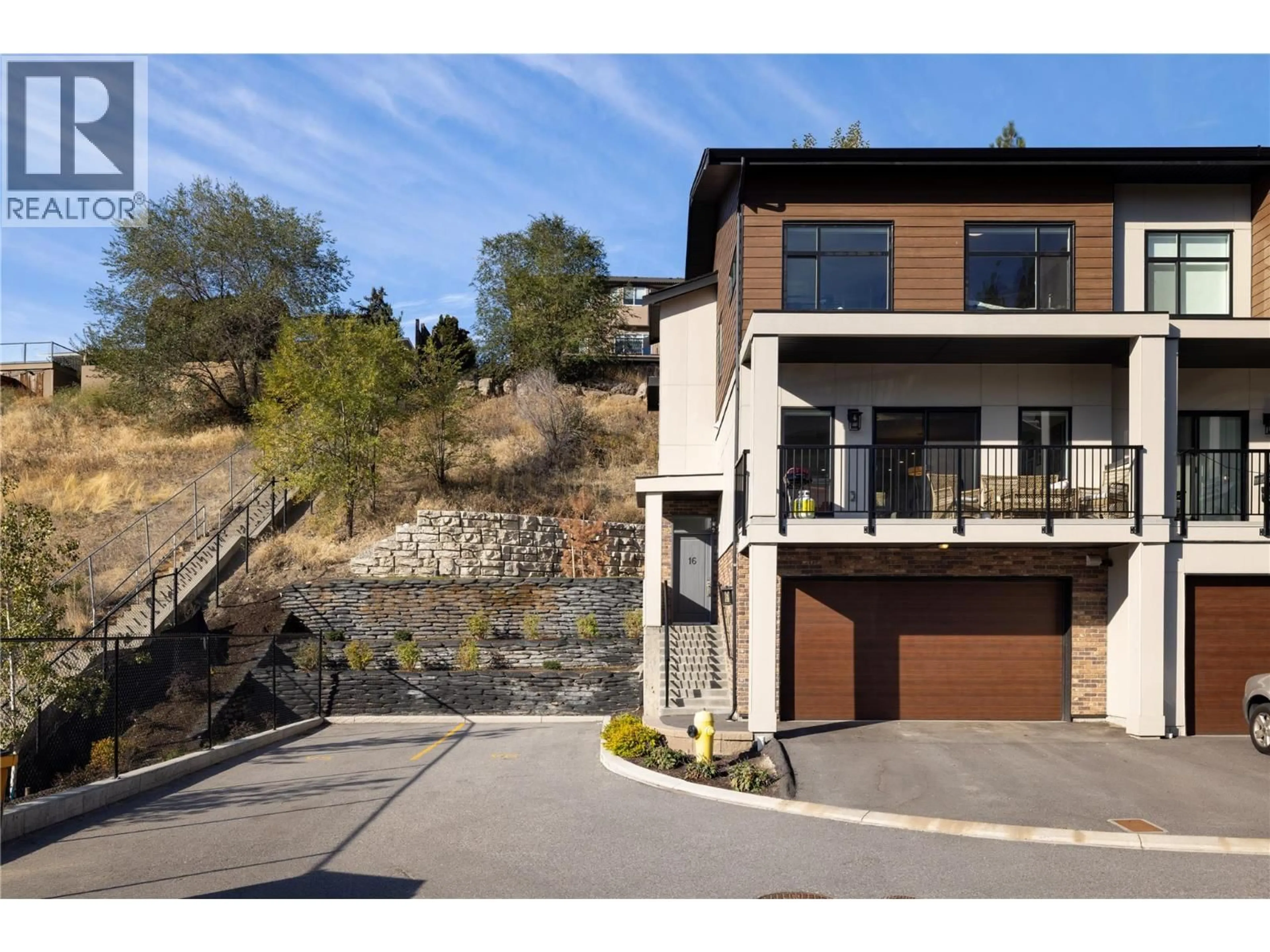 Home with brick exterior material, street for 16 - 1136 BLACK MOUNTAIN DRIVE, Kelowna British Columbia V1P0A7