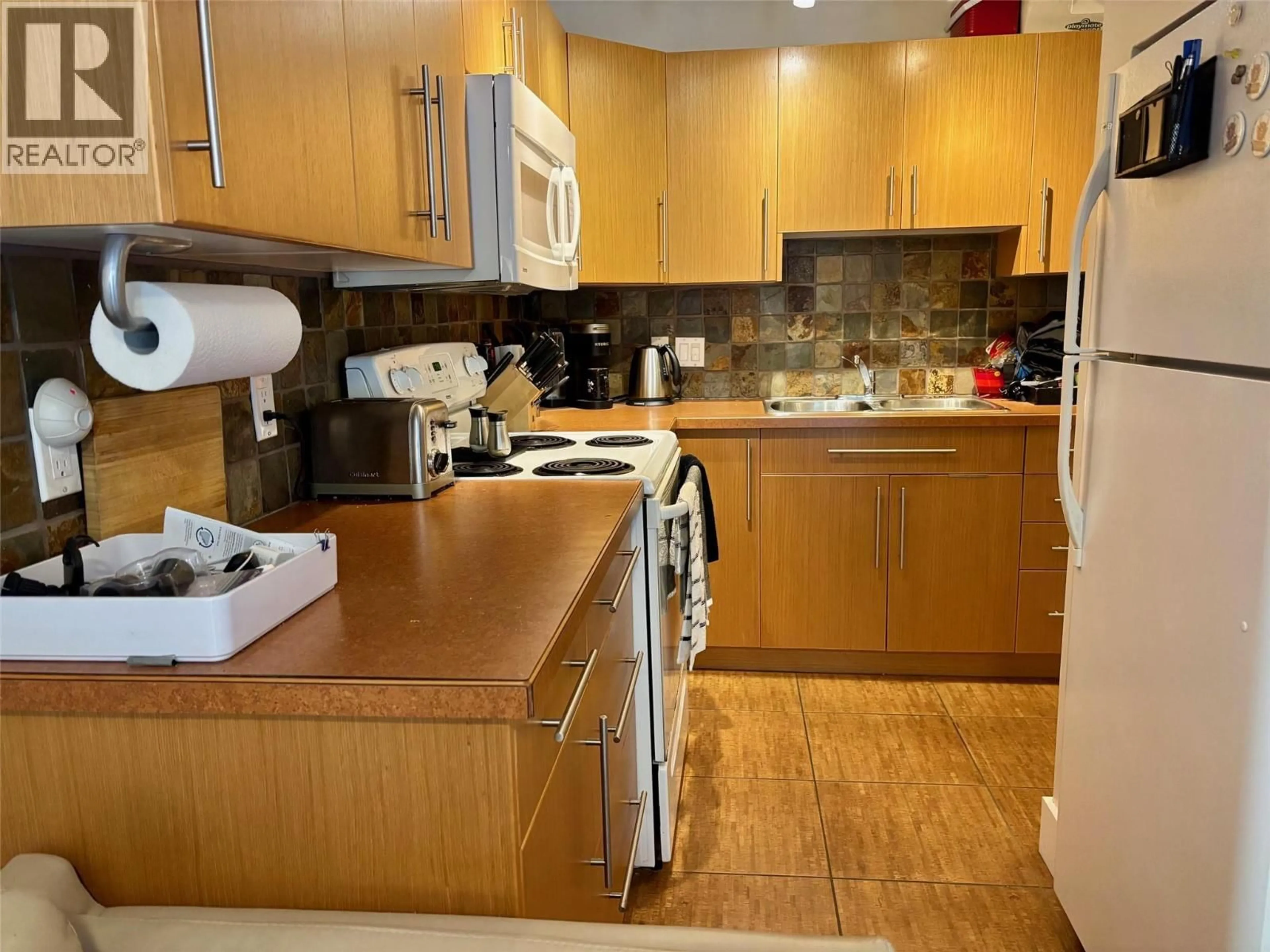 Standard kitchen, wood/laminate floor for 102 - 800 MACKENZIE AVENUE, Revelstoke British Columbia V0E2S0