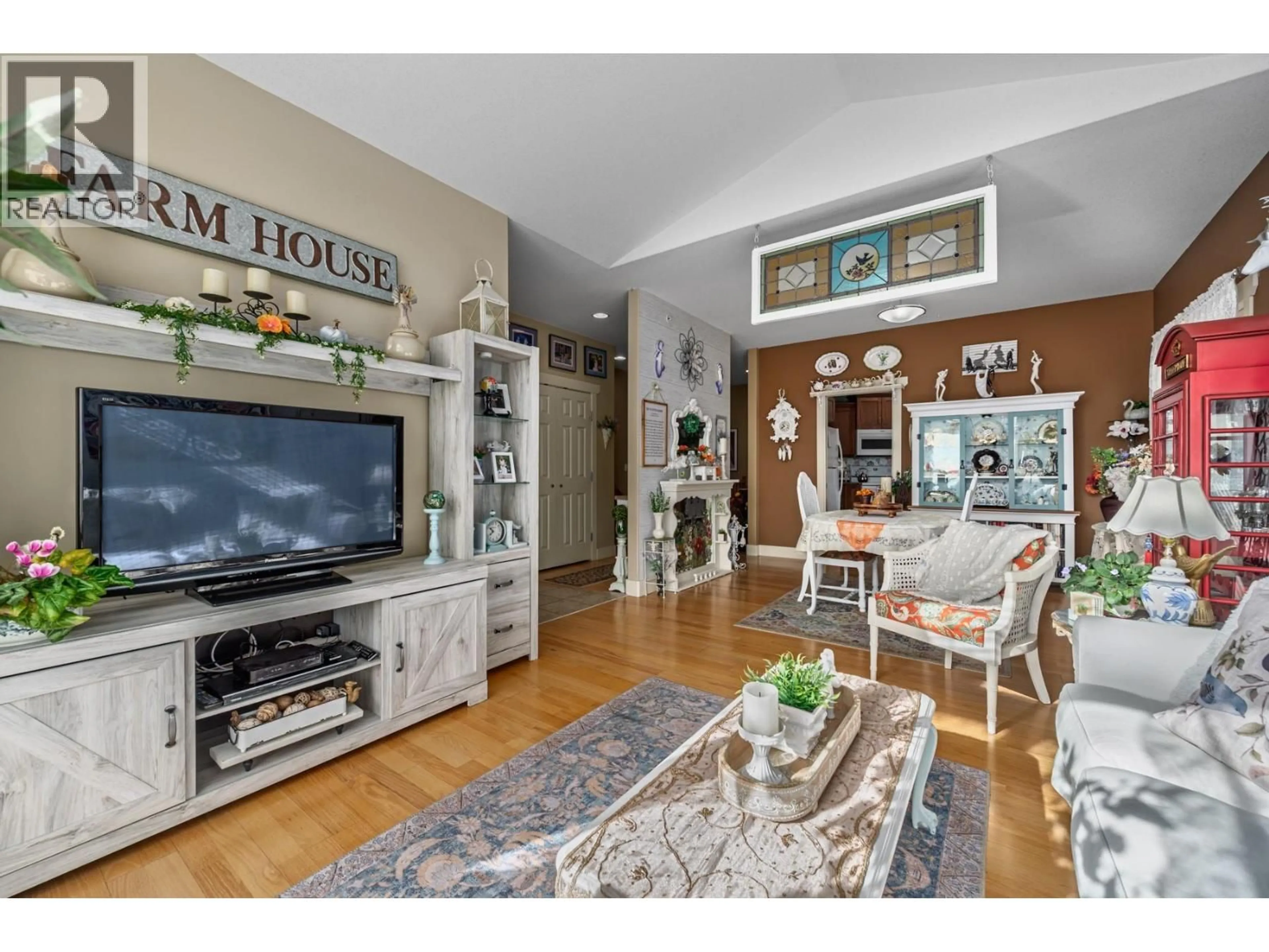 Living room with furniture, wood/laminate floor for 405 COUGAR ROAD, Kamloops British Columbia V2V6V1