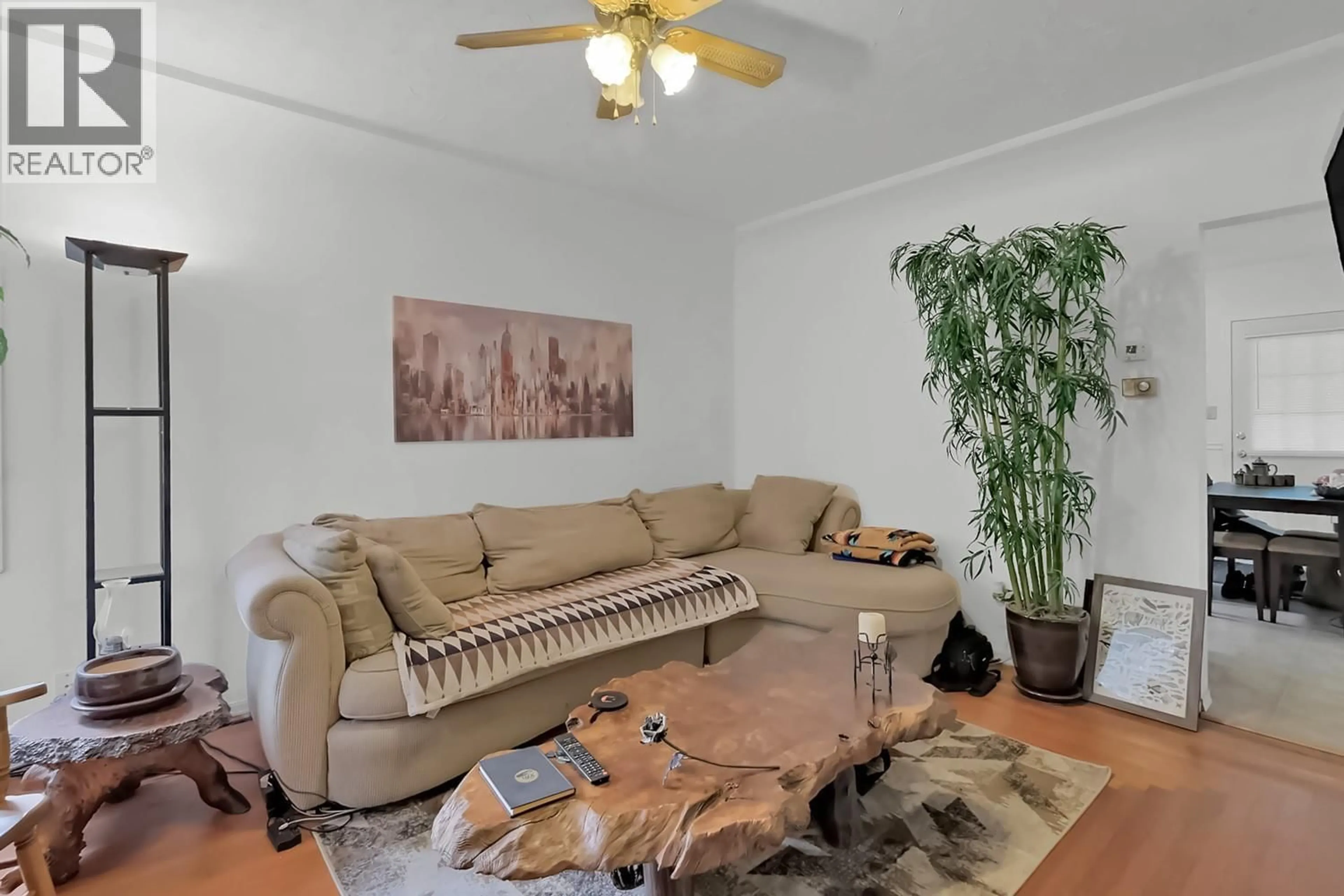 Living room with furniture, wood/laminate floor for 641 PAPINEAU STREET, Penticton British Columbia V2A4X8