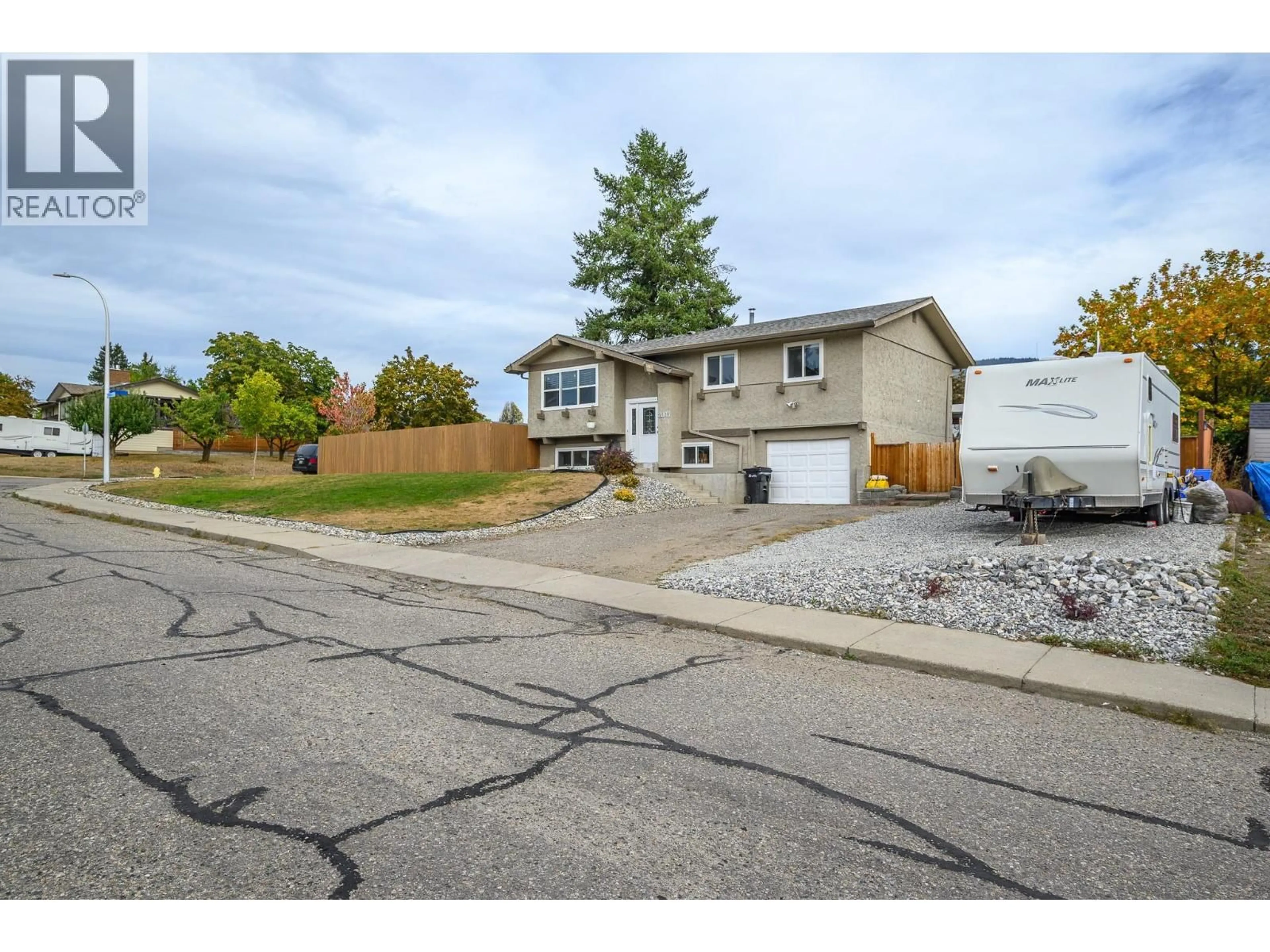 Home with vinyl exterior material, street for 2003 21 STREET, Vernon British Columbia V1T7C3