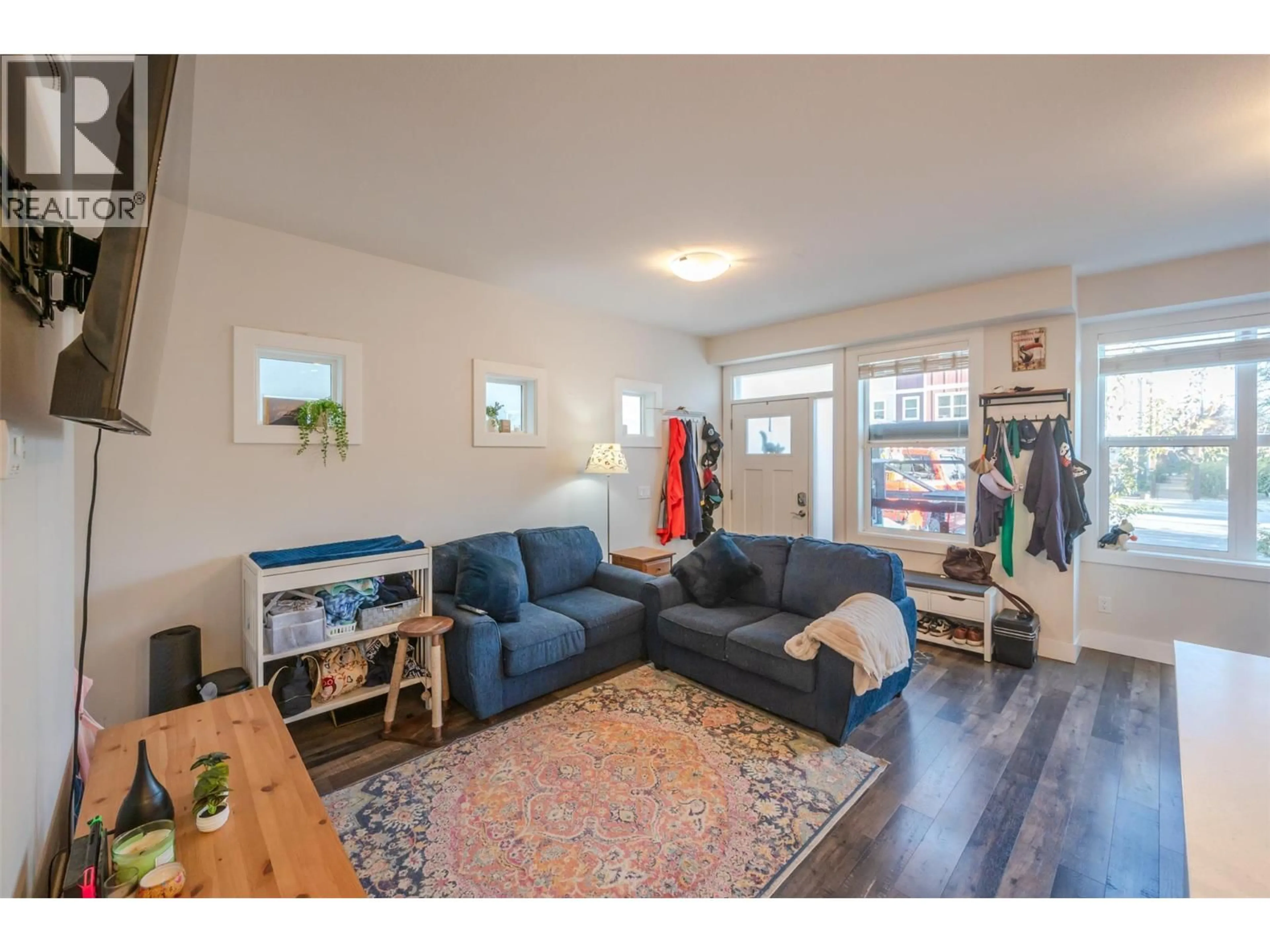 Living room with furniture, wood/laminate floor for 101 - 704 REVELSTOKE AVENUE, Penticton British Columbia V2A2J2