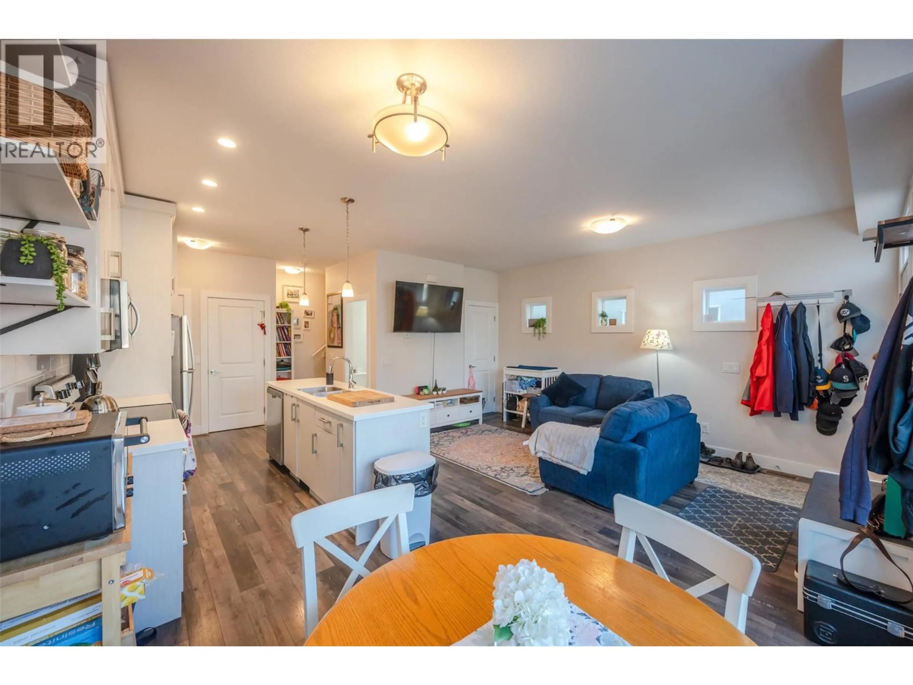 Open concept kitchen, wood/laminate floor for 101 - 704 REVELSTOKE AVENUE, Penticton British Columbia V2A2J2