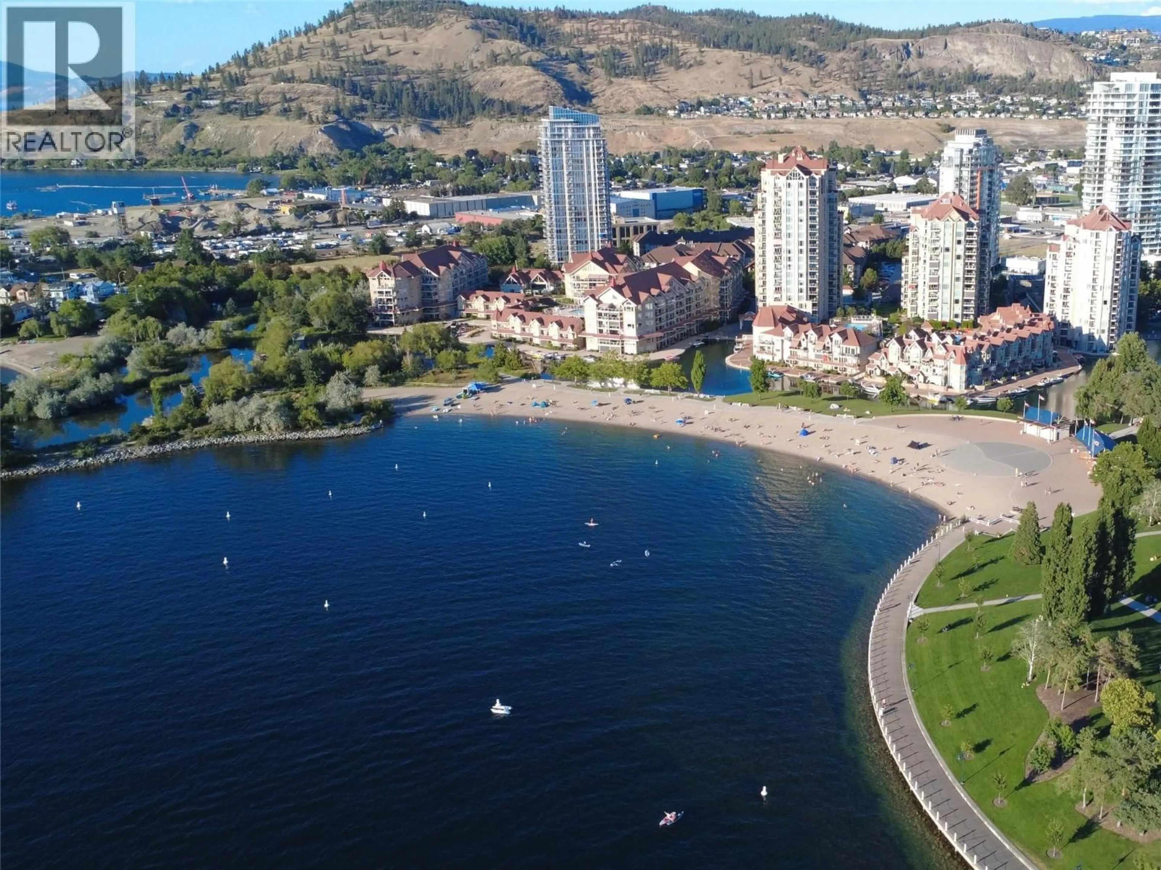 A pic from outside/outdoor area/front of a property/back of a property/a pic from drone, water/lake/river/ocean view for 2407 - 1075 SUNSET DRIVE, Kelowna British Columbia V1Y9Y9