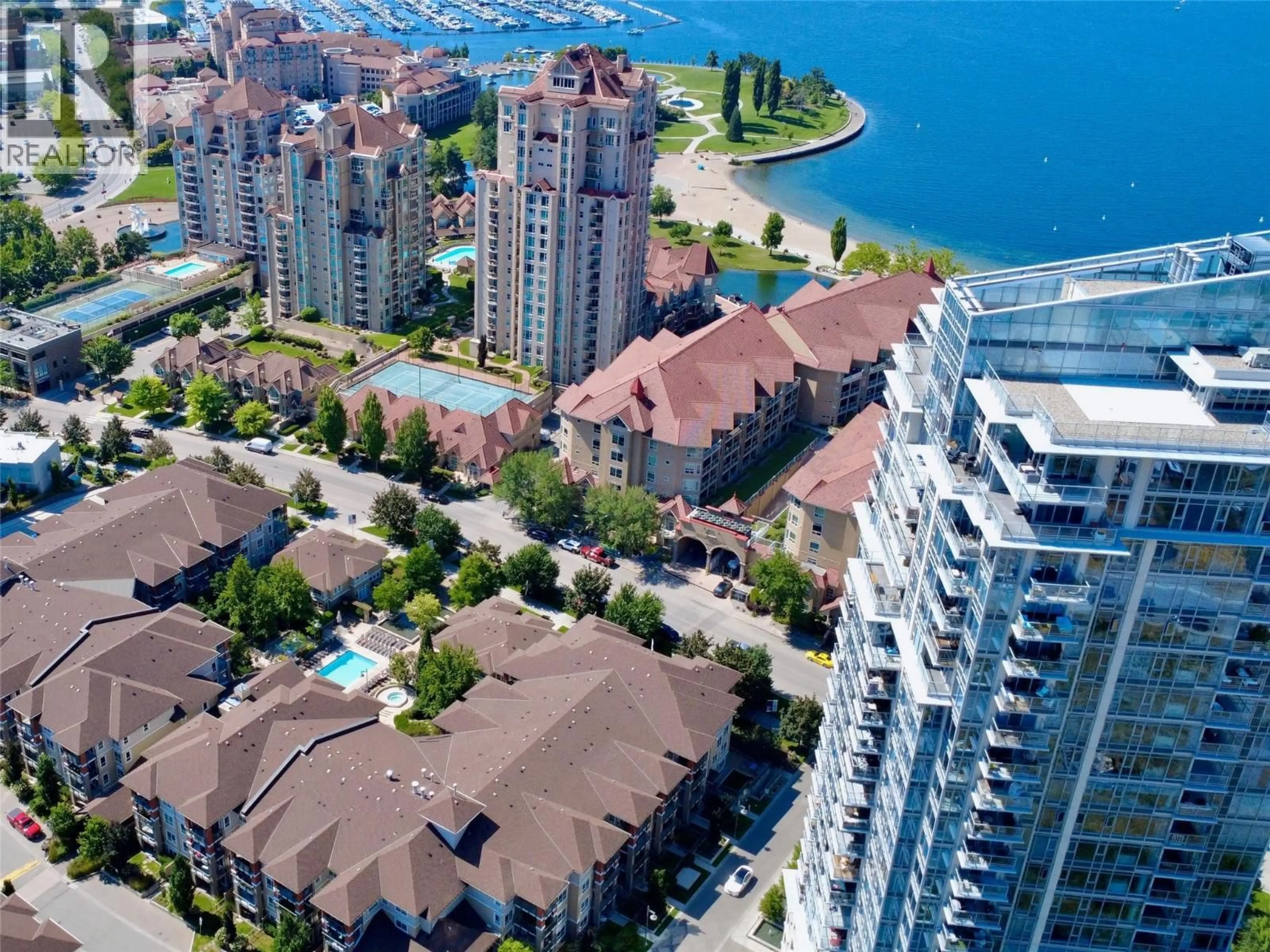 A pic from outside/outdoor area/front of a property/back of a property/a pic from drone, water/lake/river/ocean view for 2407 - 1075 SUNSET DRIVE, Kelowna British Columbia V1Y9Y9