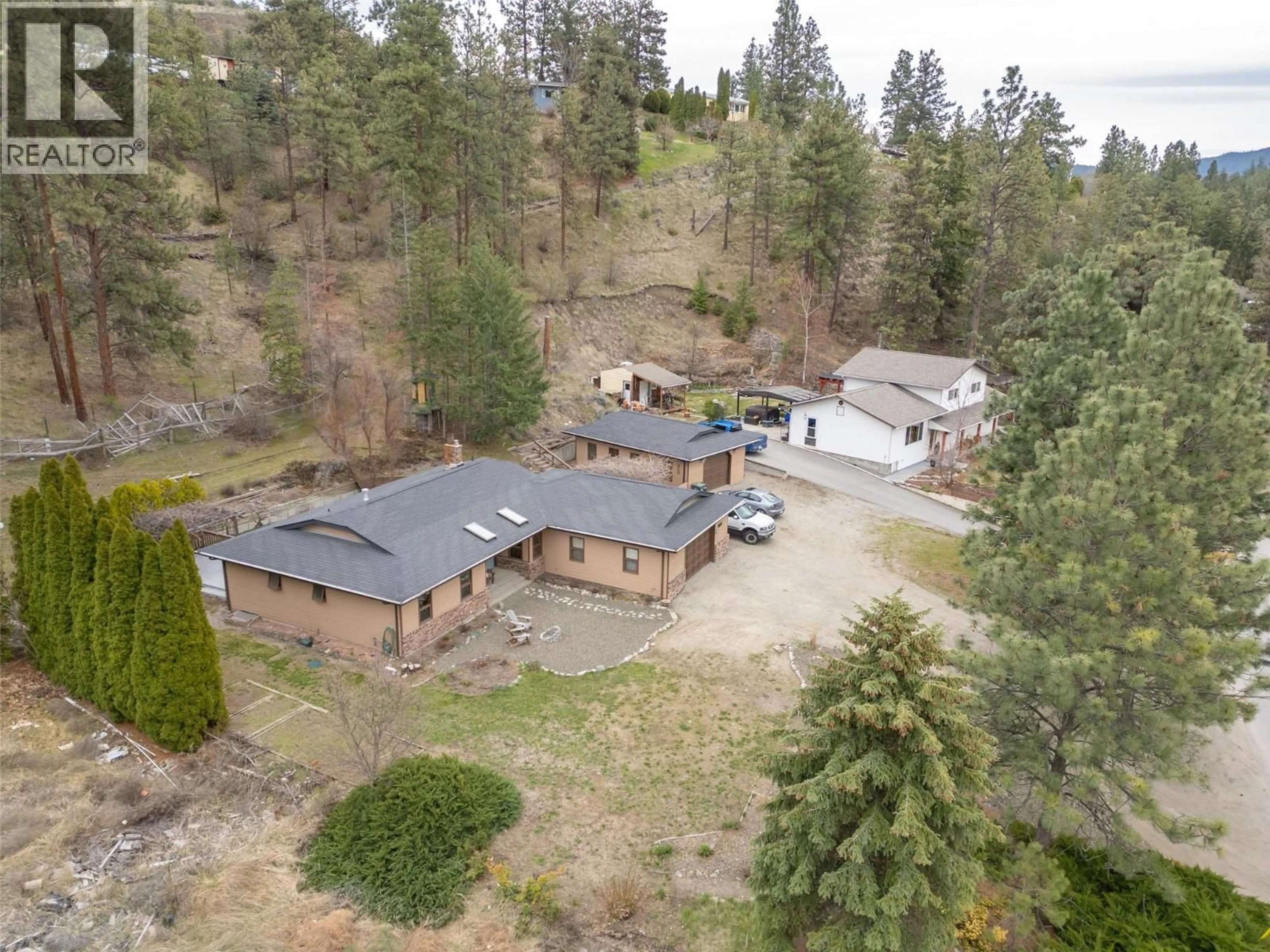 A pic from outside/outdoor area/front of a property/back of a property/a pic from drone, unknown for 8015 VICTORIA ROAD SOUTH, Summerland British Columbia V0H1Z2