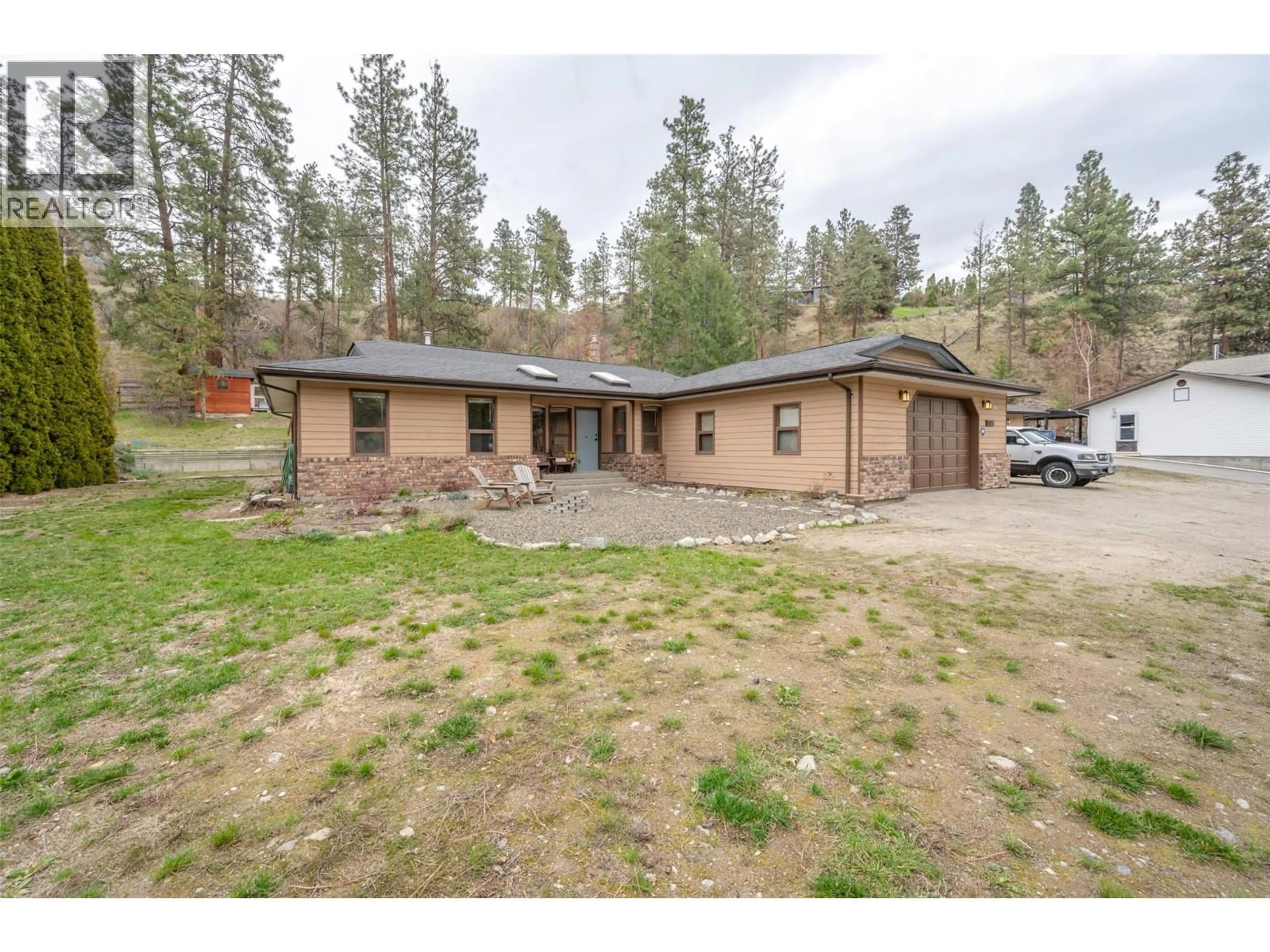 A pic from outside/outdoor area/front of a property/back of a property/a pic from drone, unknown for 8015 VICTORIA ROAD SOUTH, Summerland British Columbia V0H1Z2