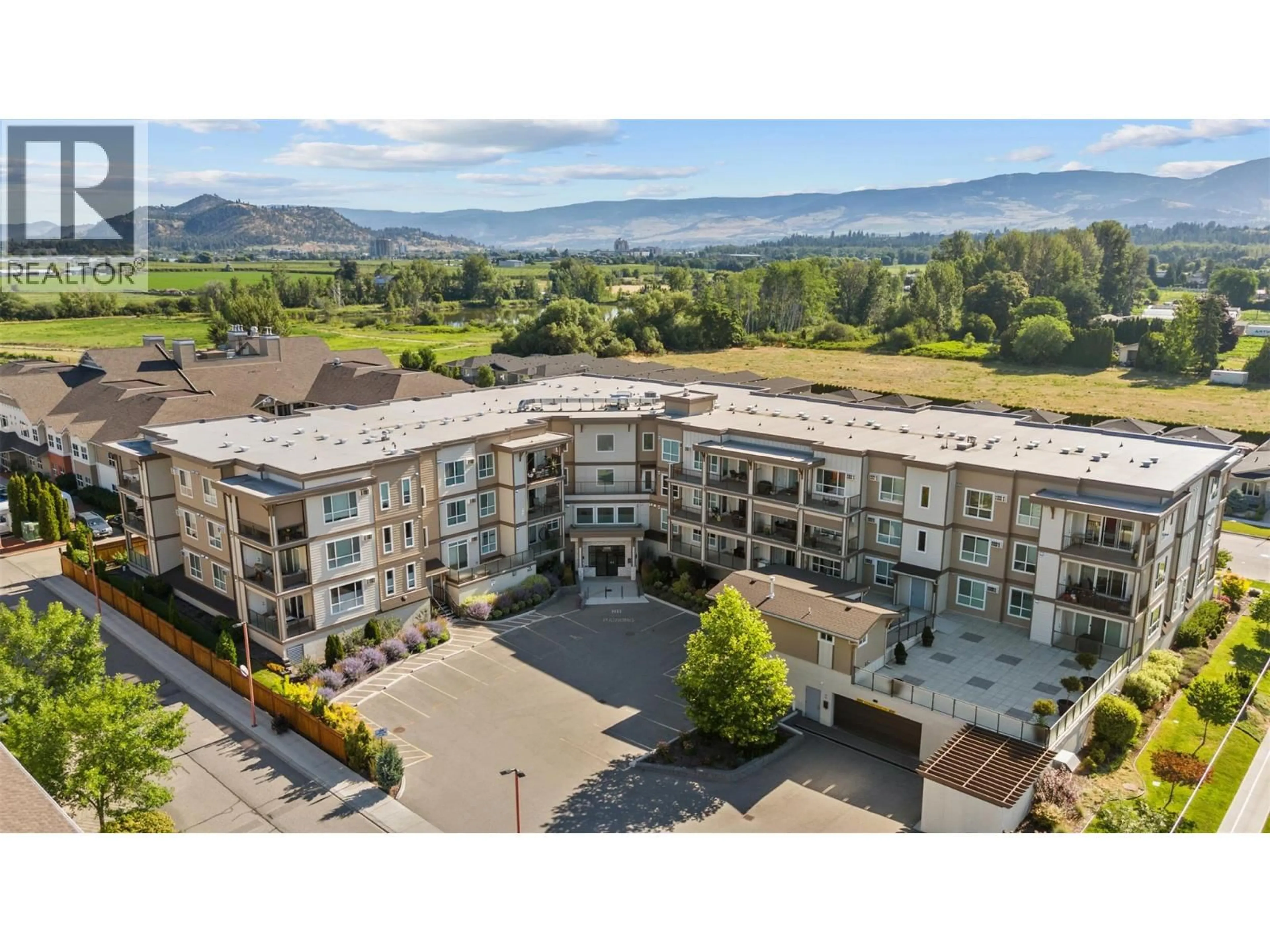 A pic from outside/outdoor area/front of a property/back of a property/a pic from drone, mountain view for 313 - 3090 BURTCH ROAD, Kelowna British Columbia V1W5G9
