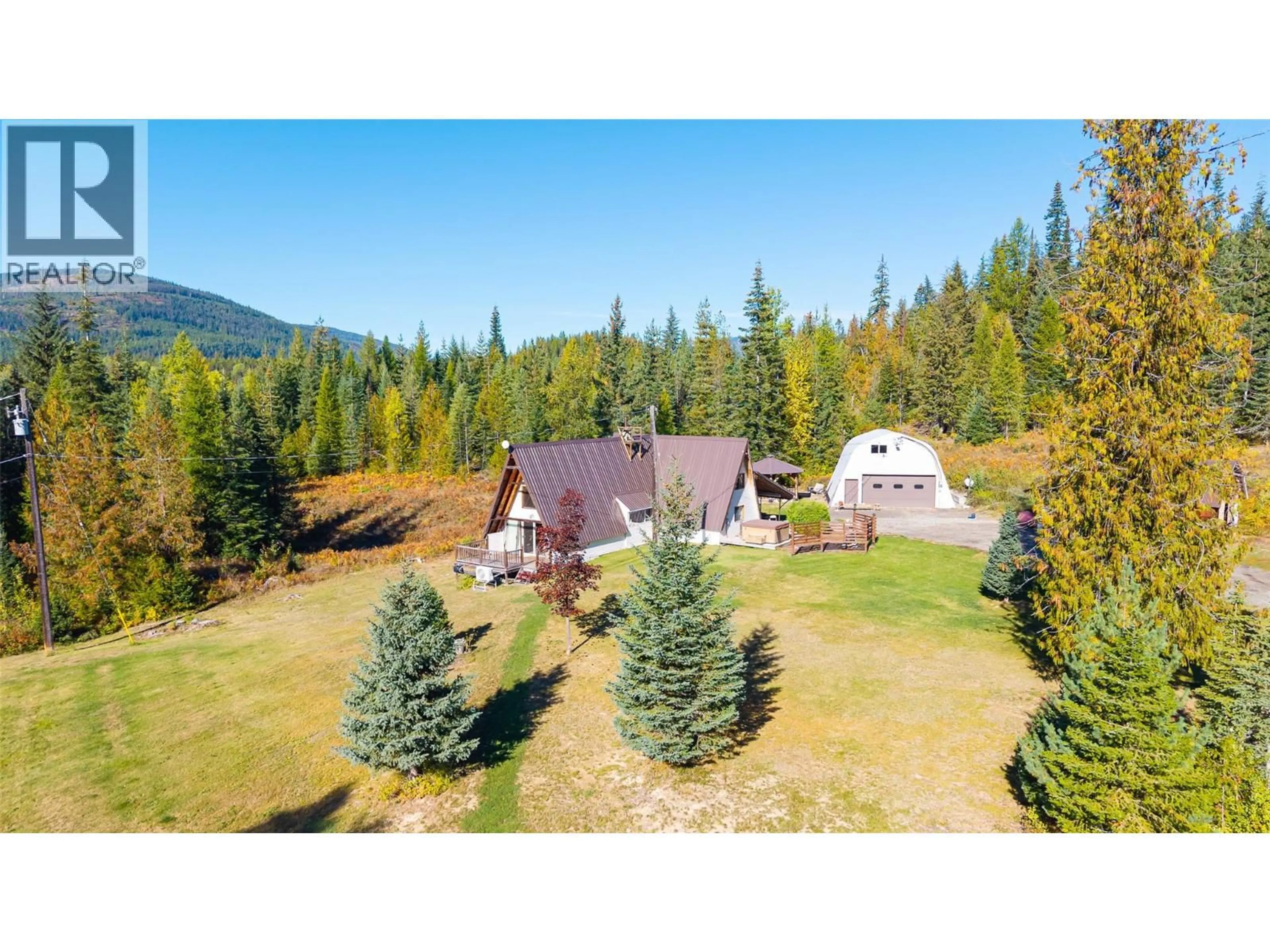 A pic from outside/outdoor area/front of a property/back of a property/a pic from drone, mountain view for 7698 3 HIGHWAY, Yahk British Columbia V0B2P0