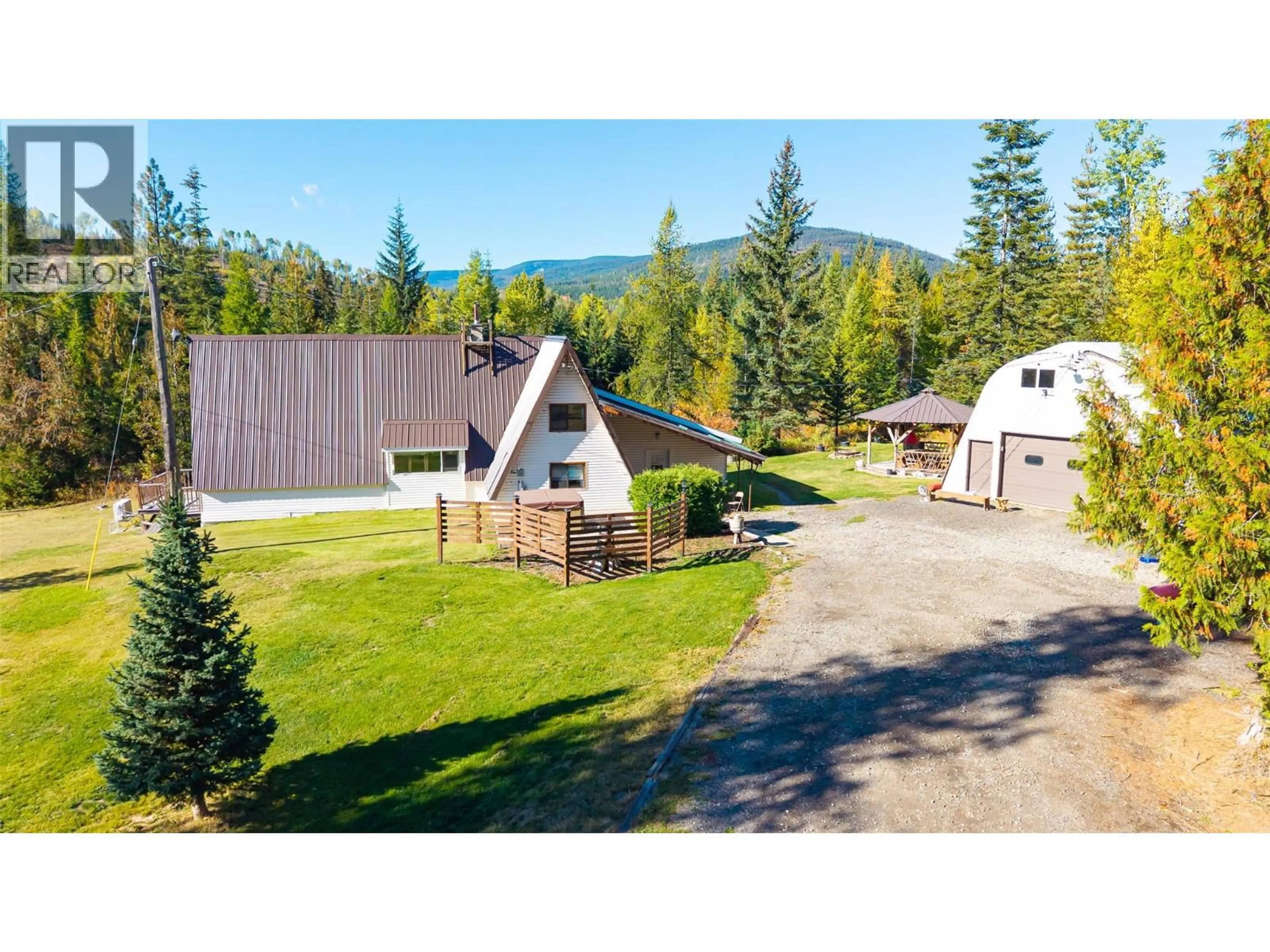 A pic from outside/outdoor area/front of a property/back of a property/a pic from drone, mountain view for 7698 3 HIGHWAY, Yahk British Columbia V0B2P0