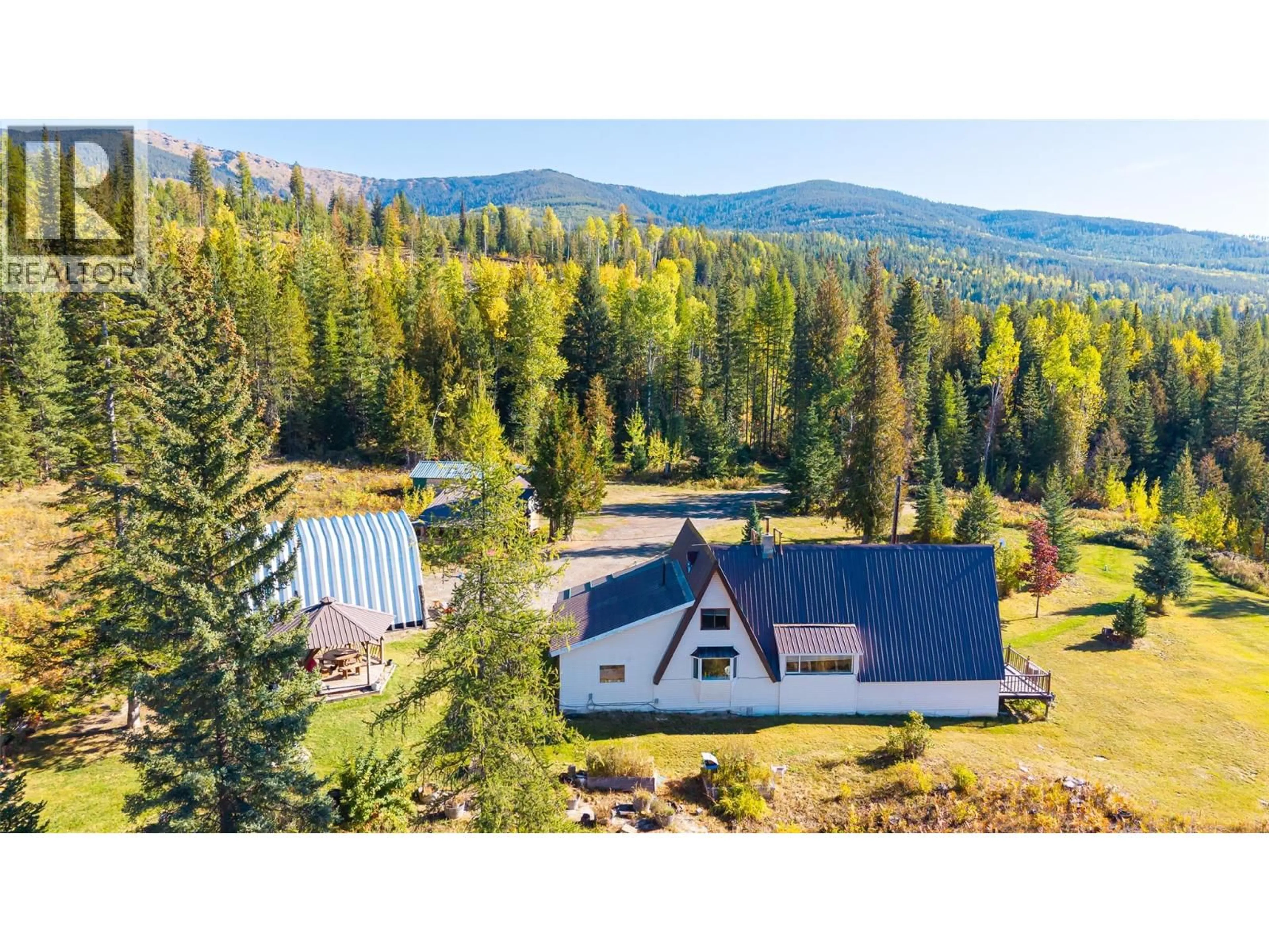 A pic from outside/outdoor area/front of a property/back of a property/a pic from drone, mountain view for 7698 3 HIGHWAY, Yahk British Columbia V0B2P0