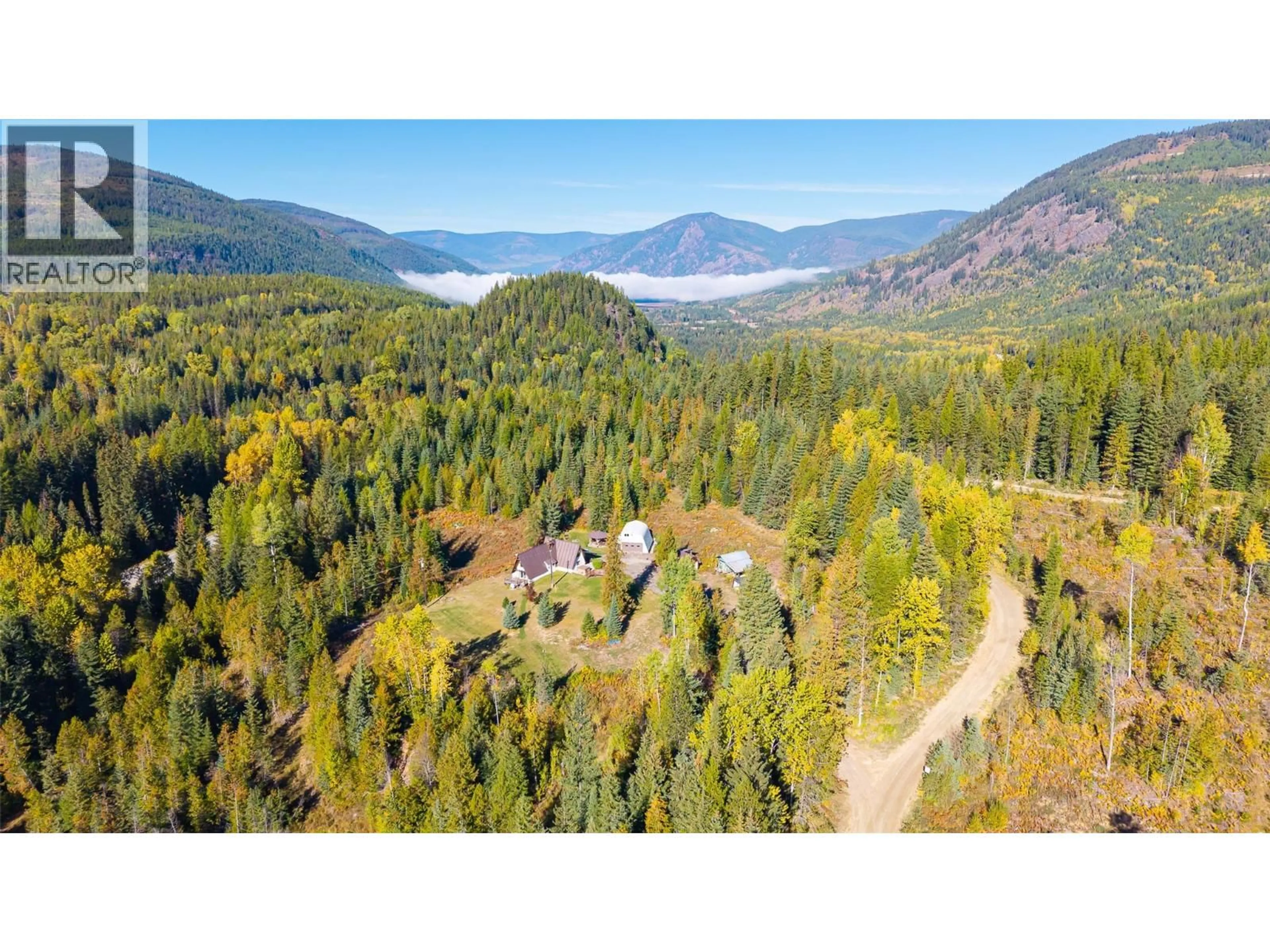 A pic from outside/outdoor area/front of a property/back of a property/a pic from drone, forest/trees view for 7698 3 HIGHWAY, Yahk British Columbia V0B2P0