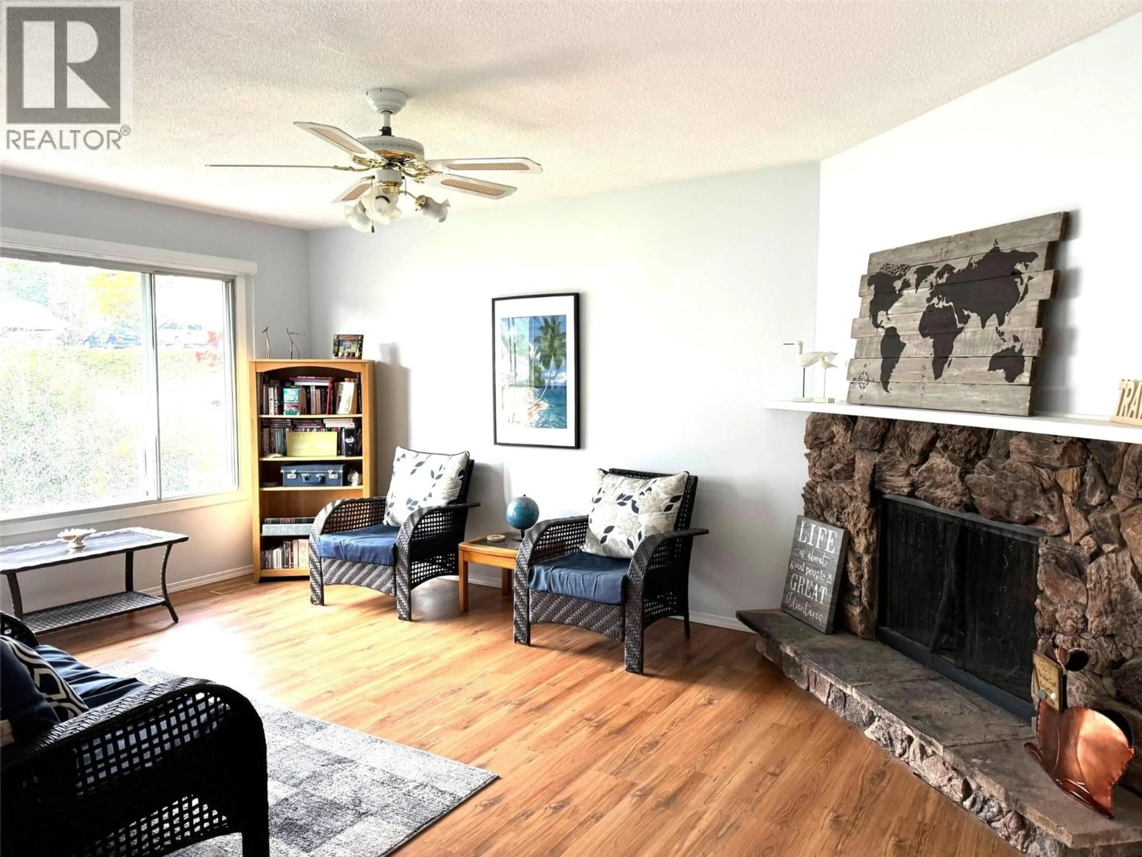 Living room with furniture, wood/laminate floor for 3377 MCIVER ROAD, West Kelowna British Columbia V4T1H7