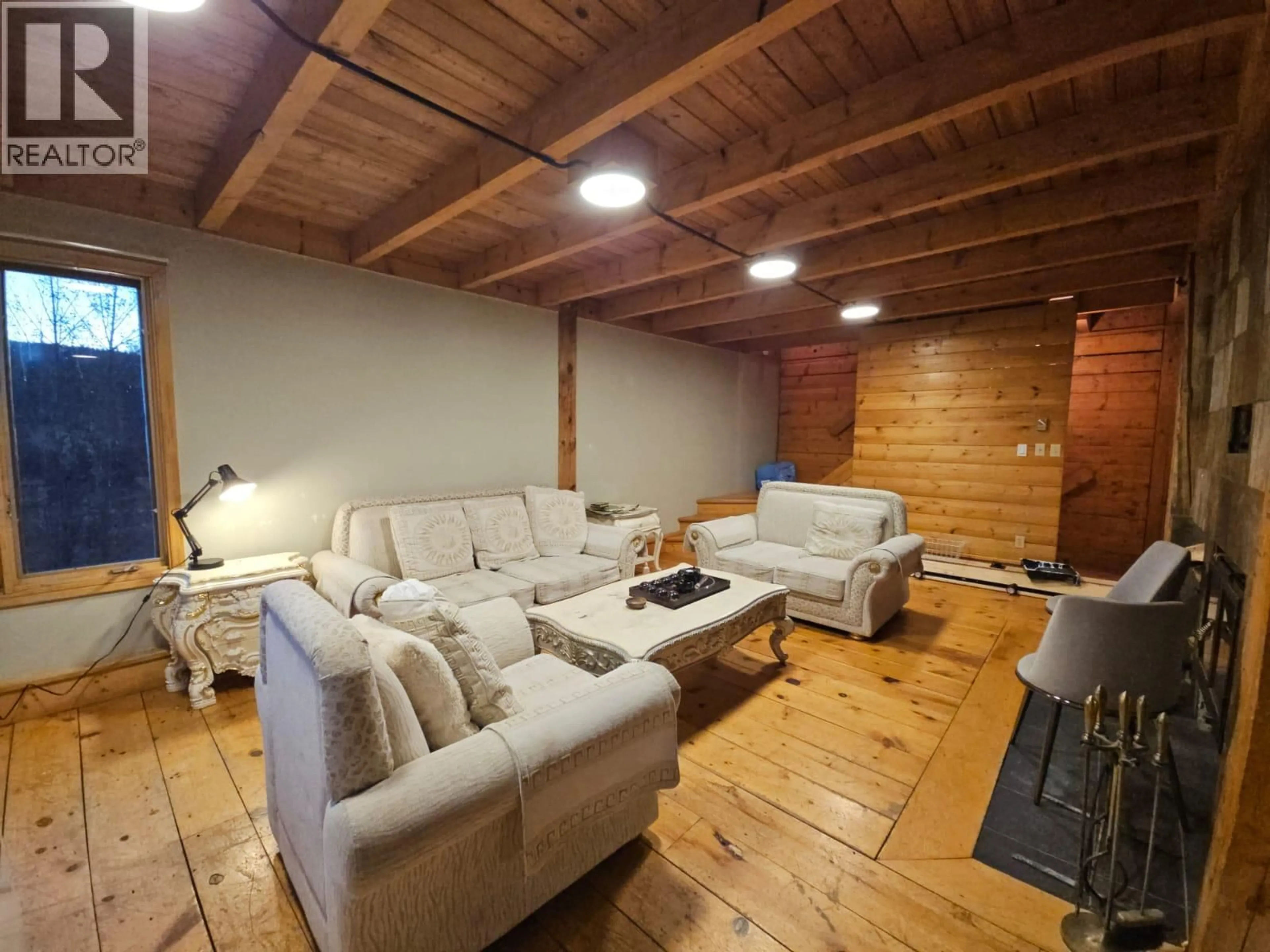 Living room with furniture, wood/laminate floor for 2601 CALLIOU ROAD, Chetwynd British Columbia V0C1J0