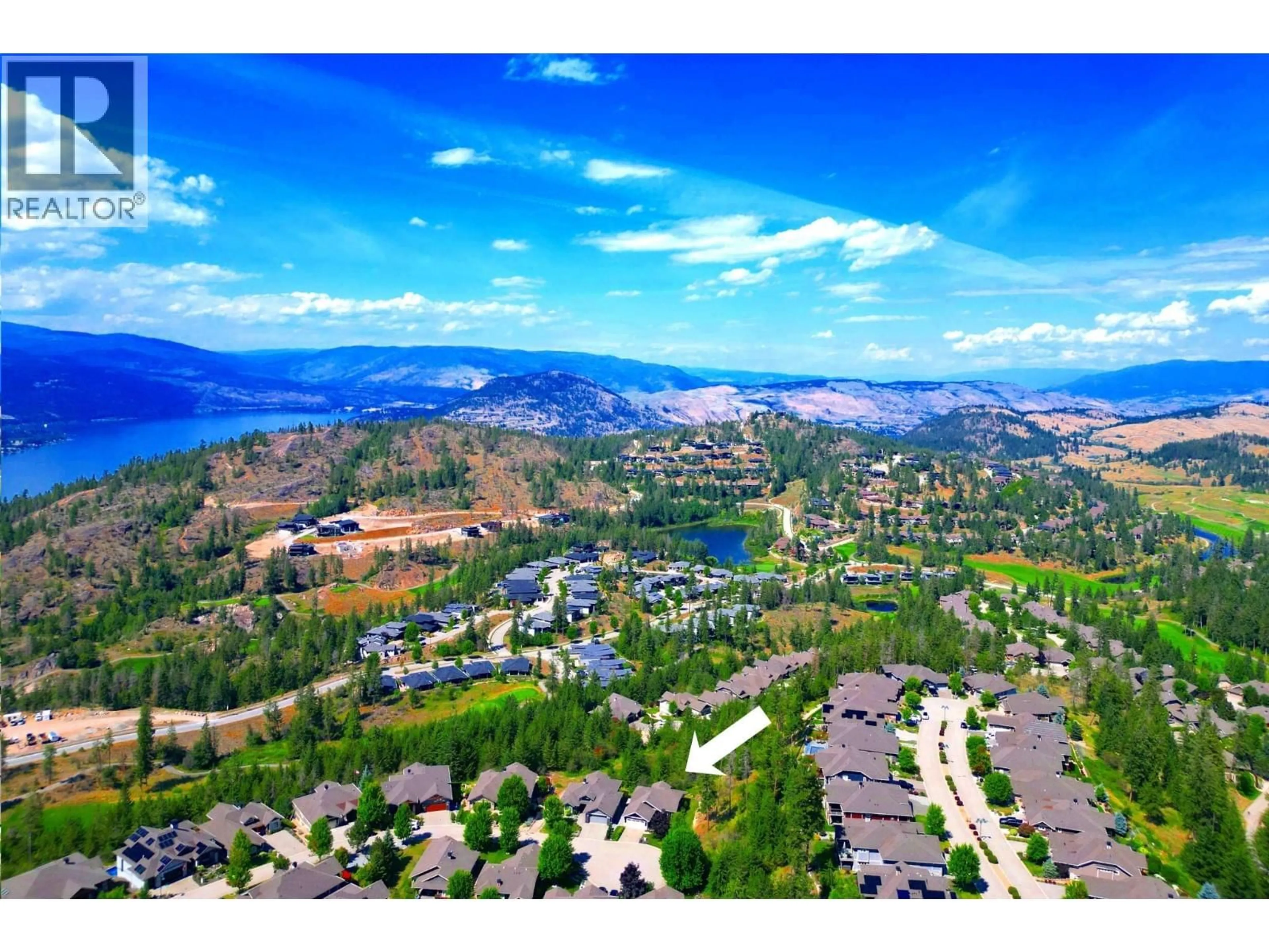 A pic from outside/outdoor area/front of a property/back of a property/a pic from drone, mountain view for 501 LONGSPOON BAY, Vernon British Columbia V1H2K2