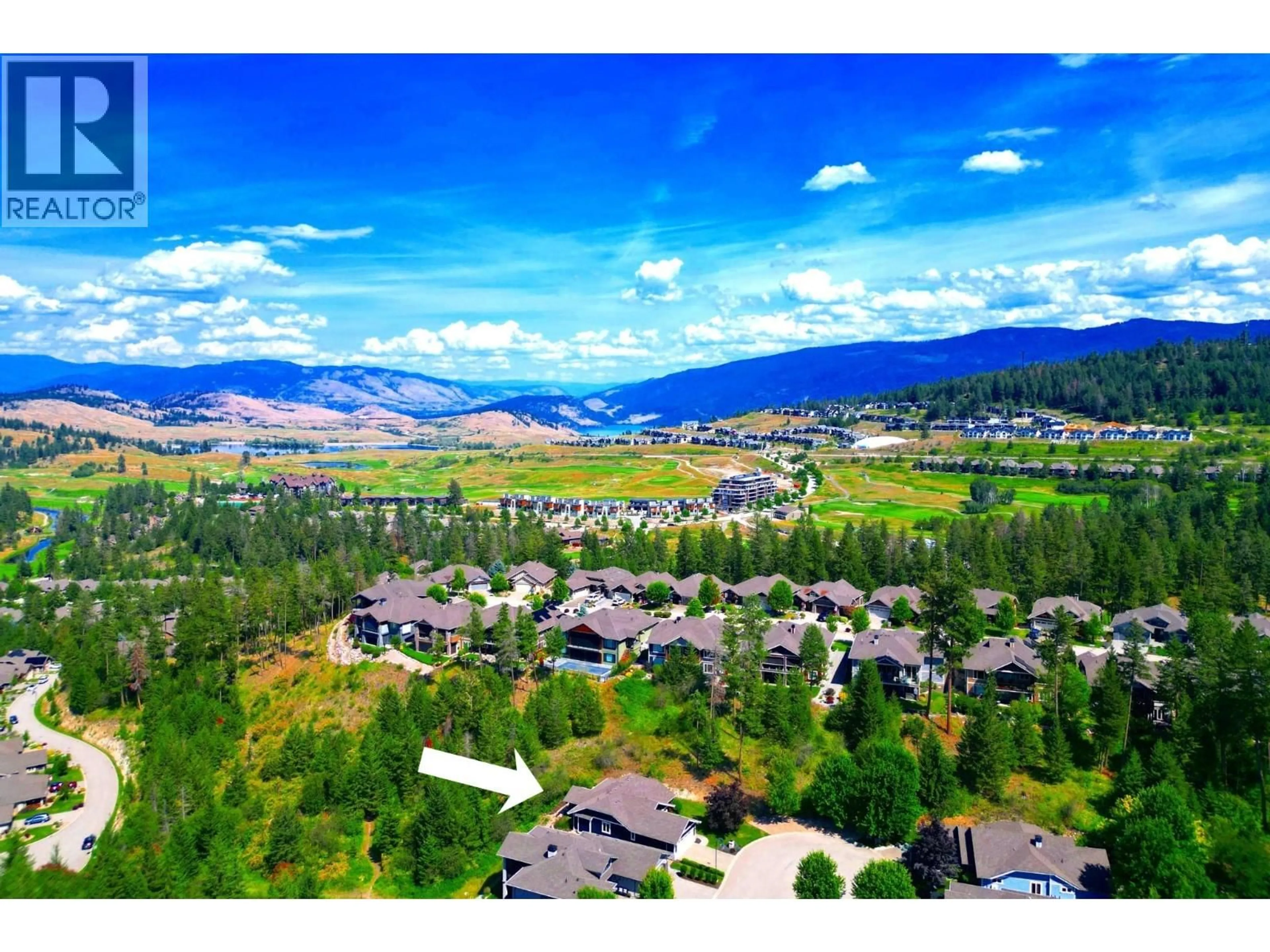 A pic from outside/outdoor area/front of a property/back of a property/a pic from drone, mountain view for 501 LONGSPOON BAY, Vernon British Columbia V1H2K2
