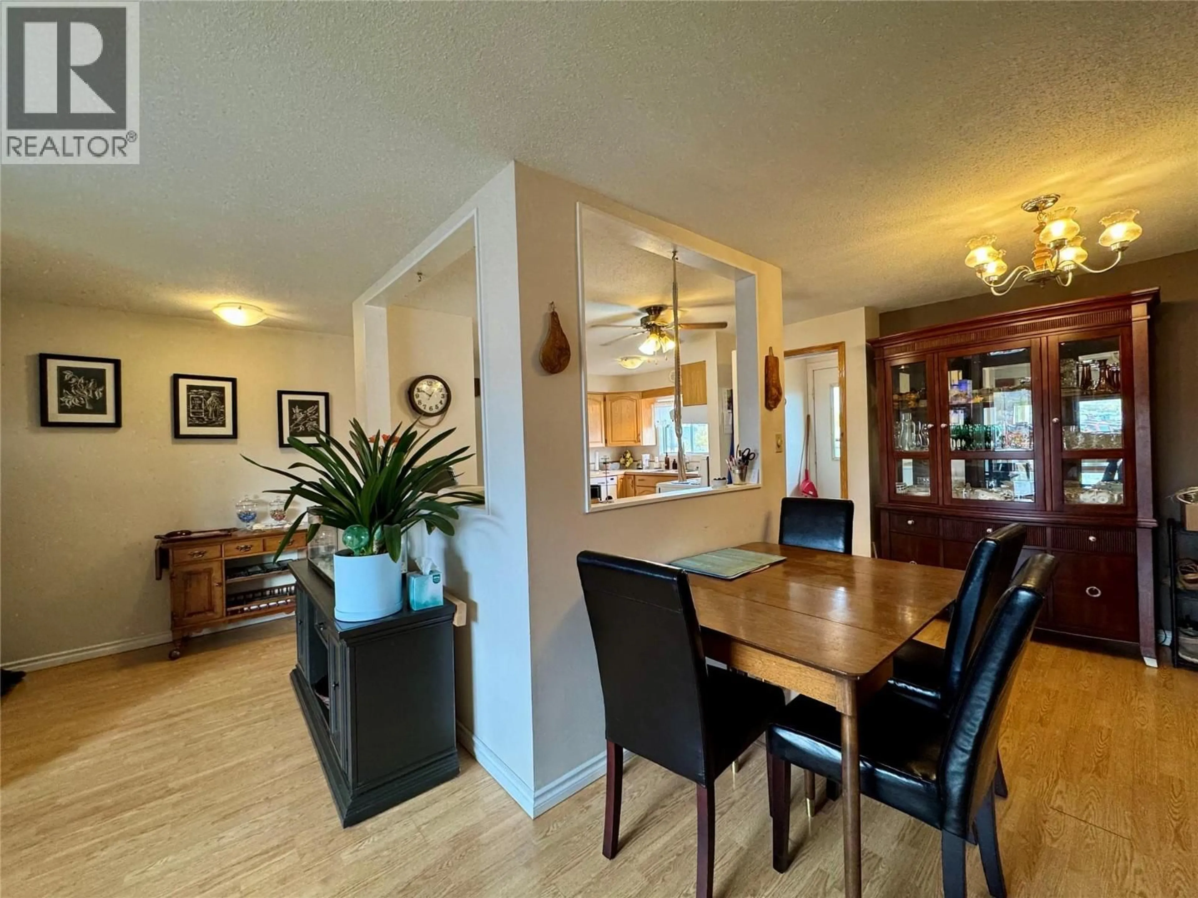 Dining room, wood/laminate floor for 940 112 AVENUE, Dawson Creek British Columbia V1G2Y3