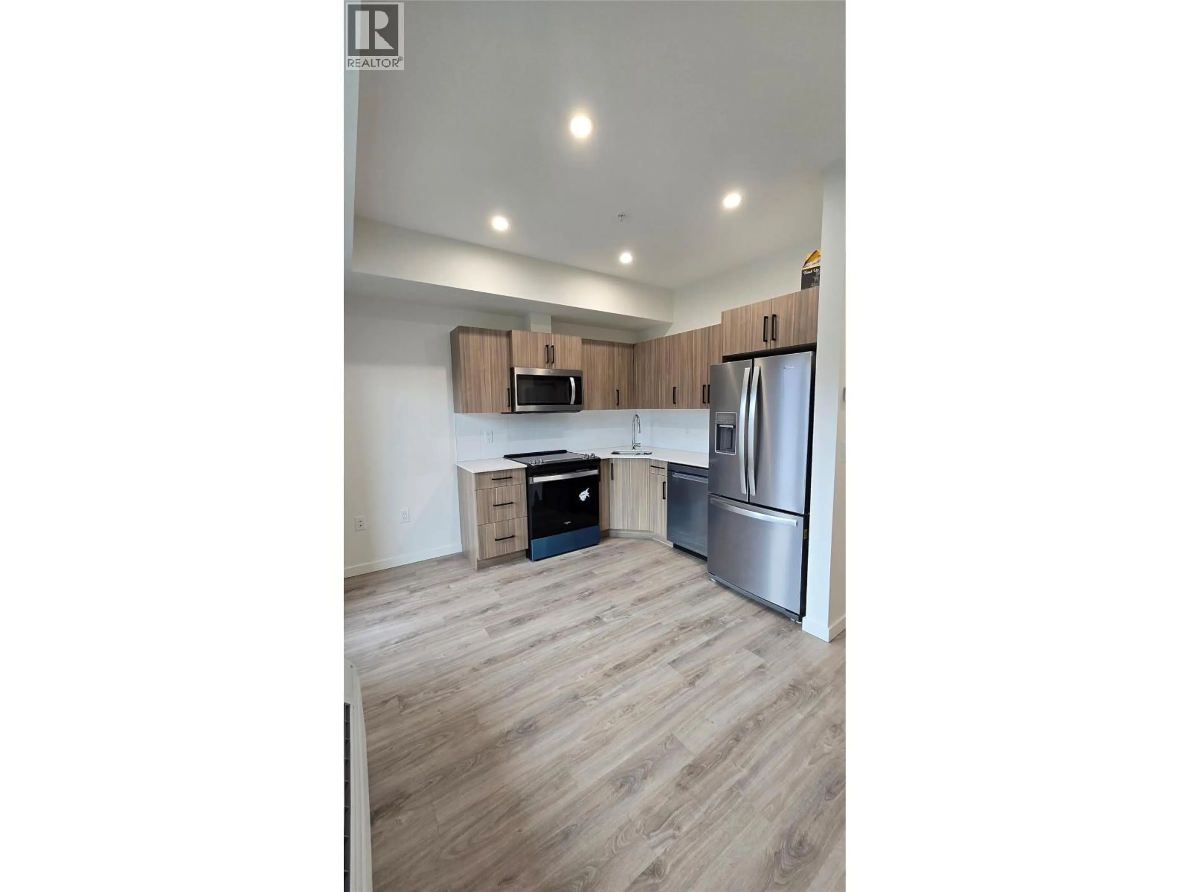 Open concept kitchen, wood/laminate floor for 309 - 2345 BUTT ROAD, West Kelowna British Columbia V4T1N6