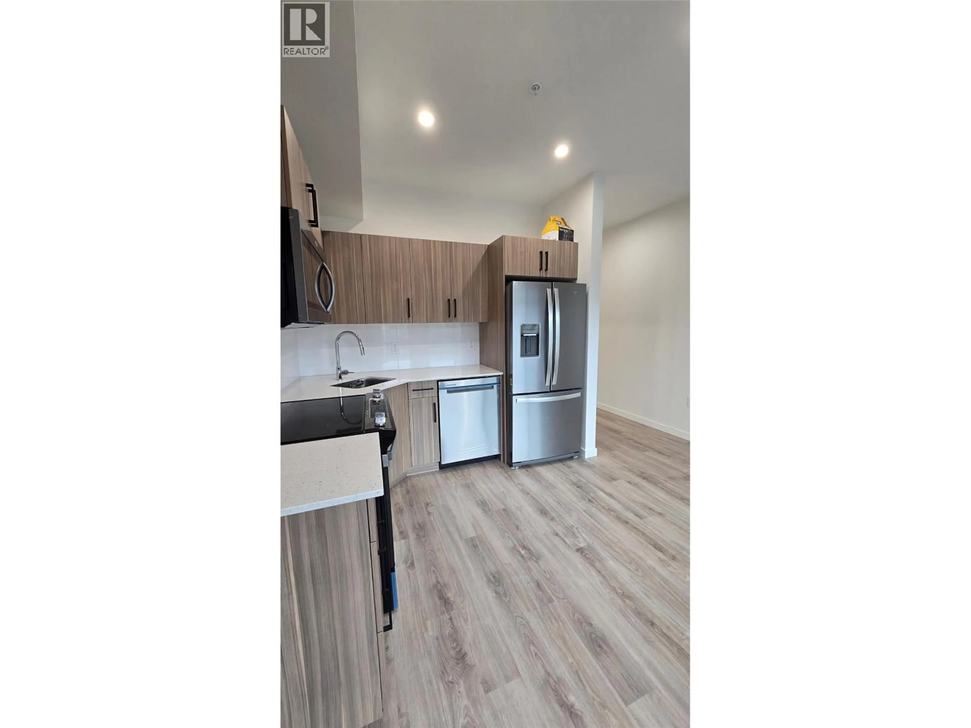 Open concept kitchen, wood/laminate floor for 309 - 2345 BUTT ROAD, West Kelowna British Columbia V4T1N6
