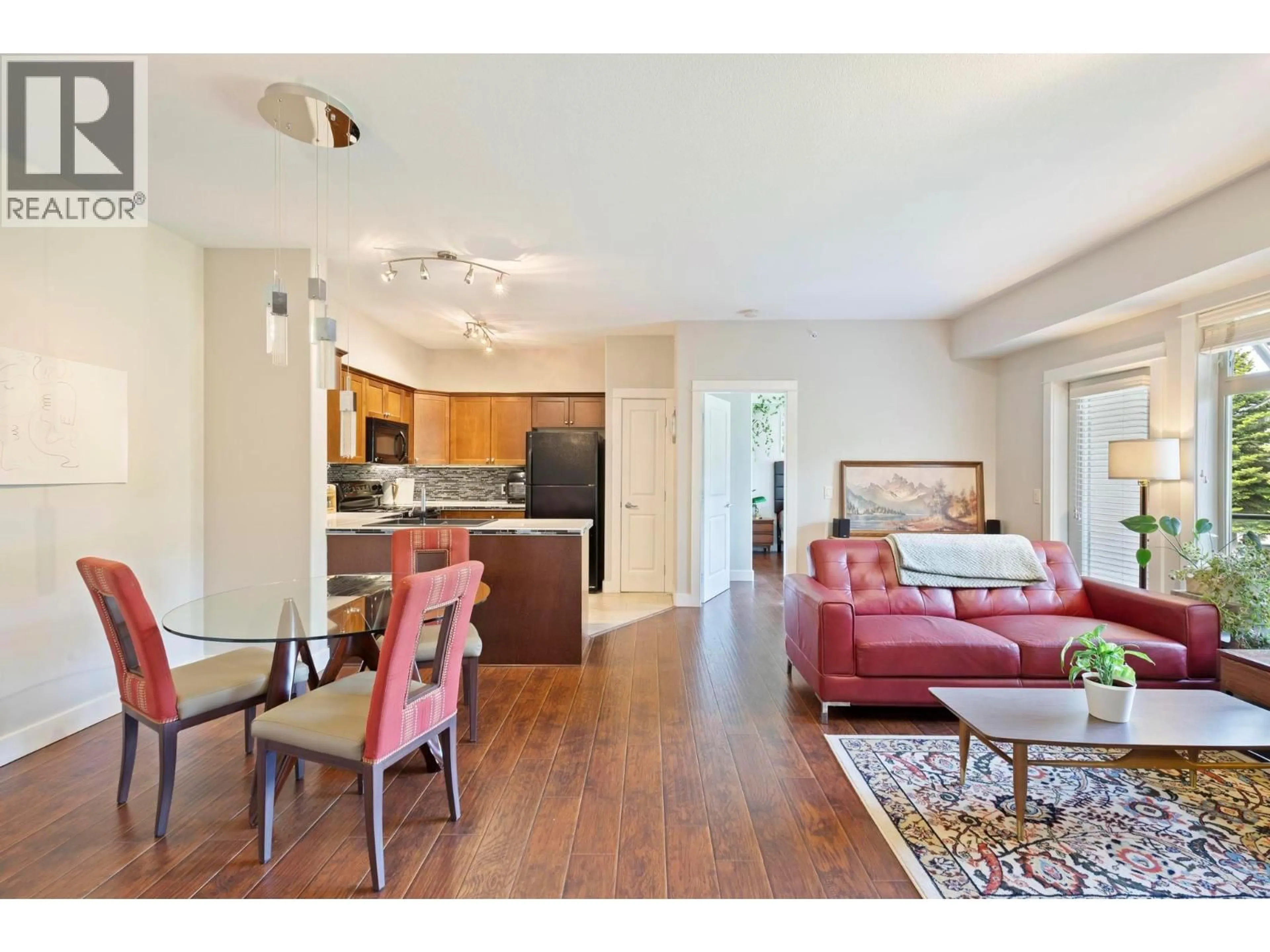 Living room with furniture, wood/laminate floor for 214 - 2611 STILLWATER WAY, Lake Country British Columbia V4V2R3