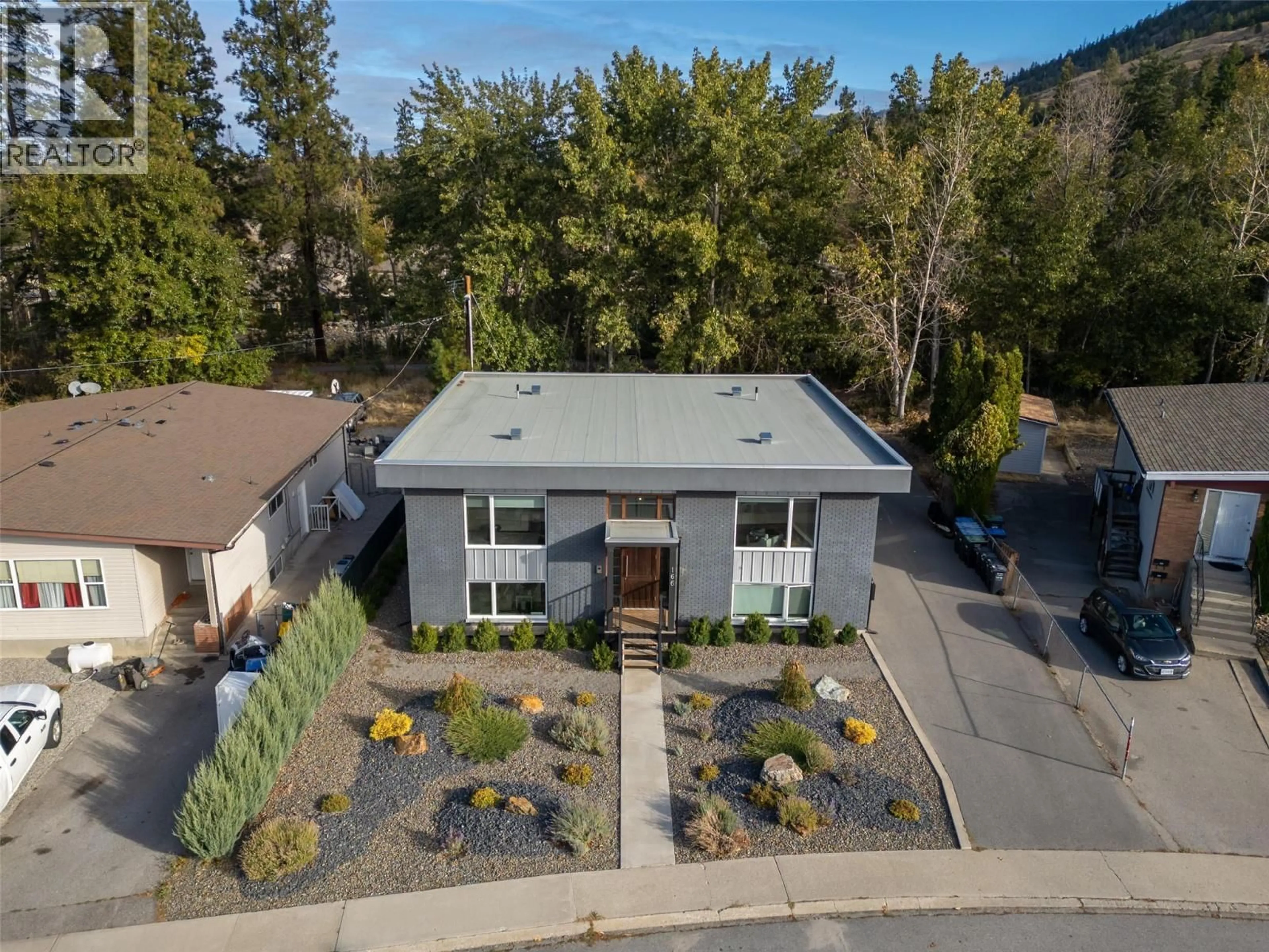 A pic from outside/outdoor area/front of a property/back of a property/a pic from drone, unknown for 166 MCPHERSON CRESCENT, Penticton British Columbia V2A2N8