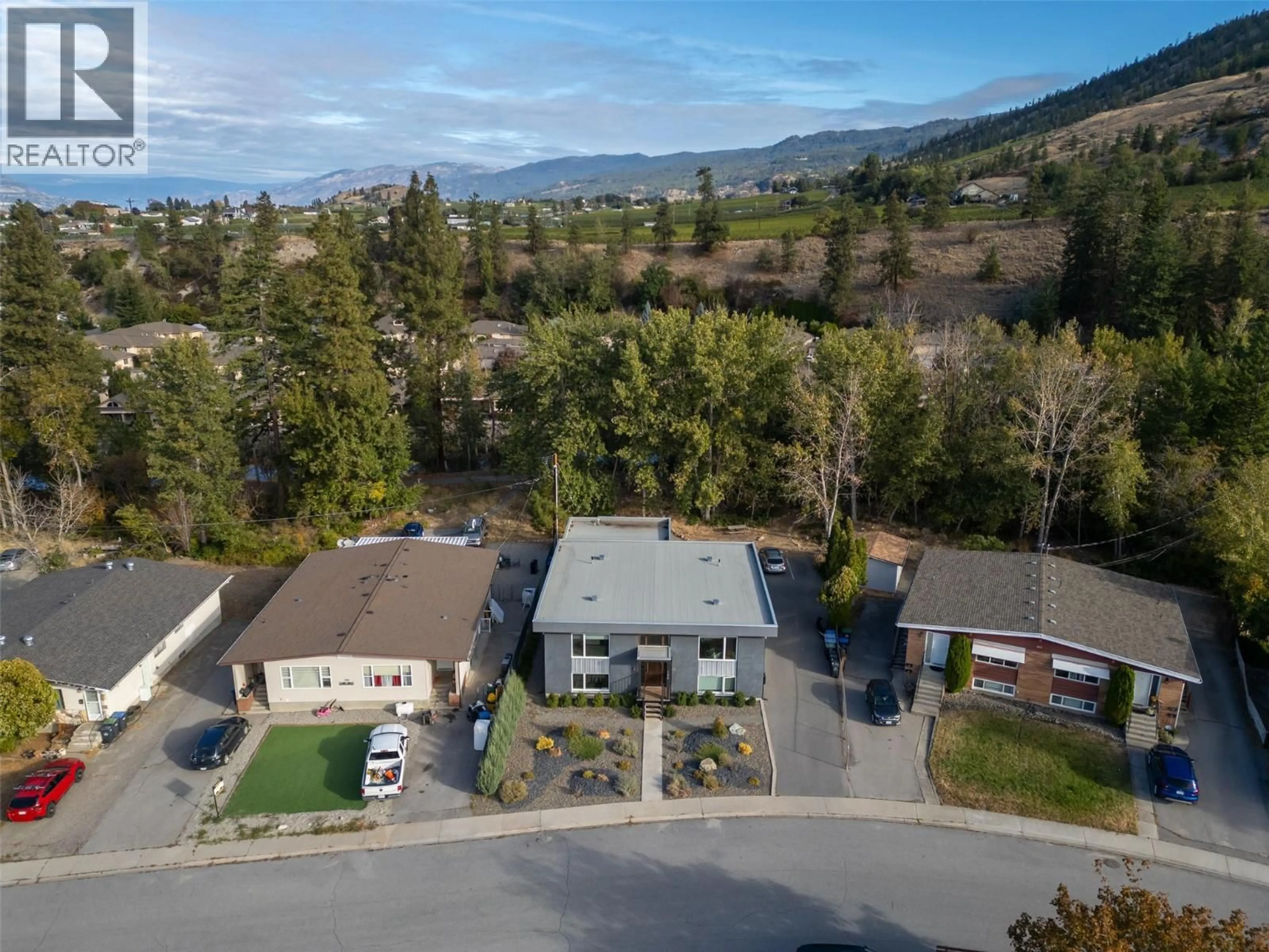 A pic from outside/outdoor area/front of a property/back of a property/a pic from drone, mountain view for 166 MCPHERSON CRESCENT, Penticton British Columbia V2A2N8
